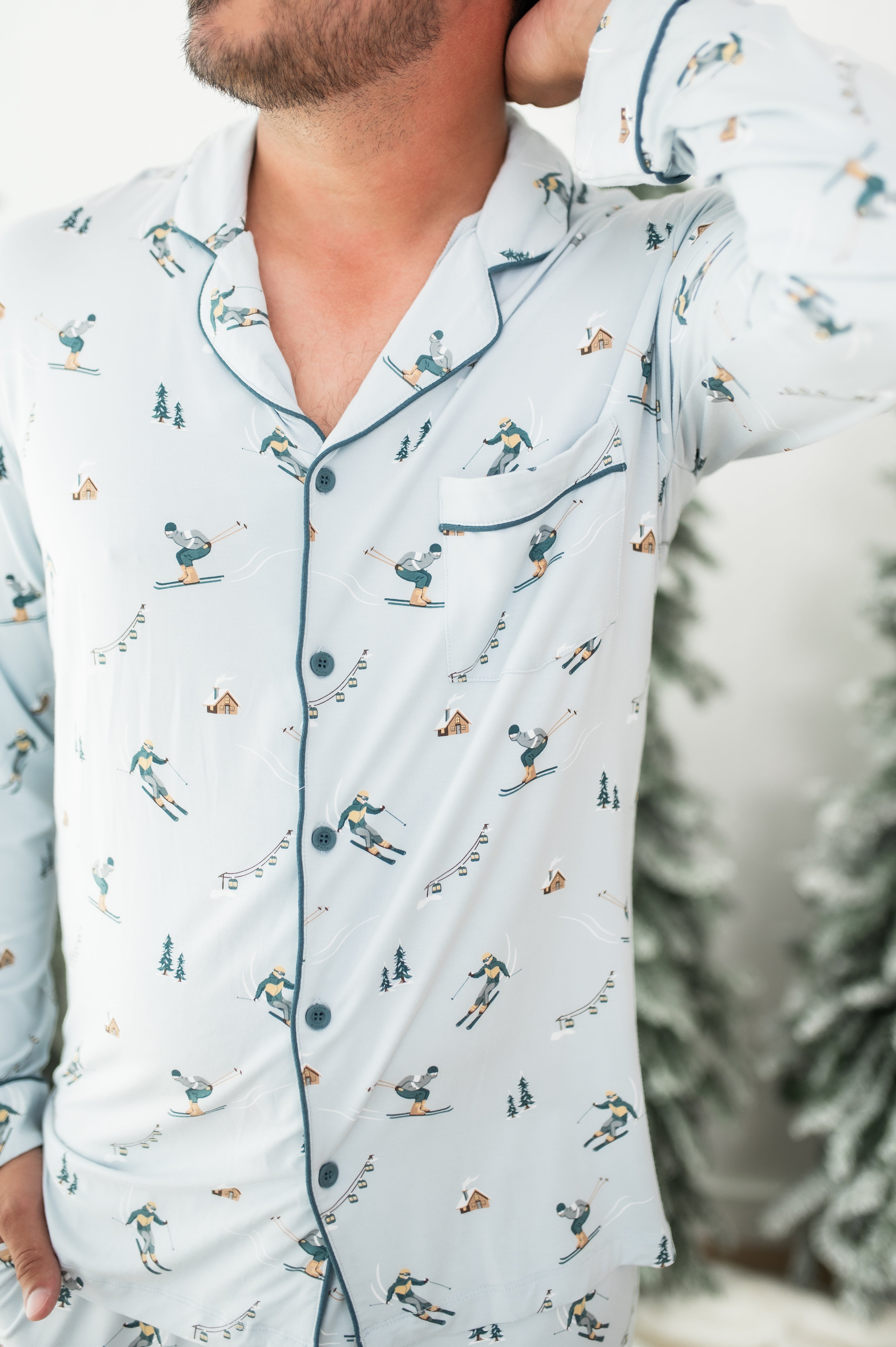 Close up of the button closures, trim and chest pocket on the shirt of the Men's Long Sleeve Pajama Set in Ski