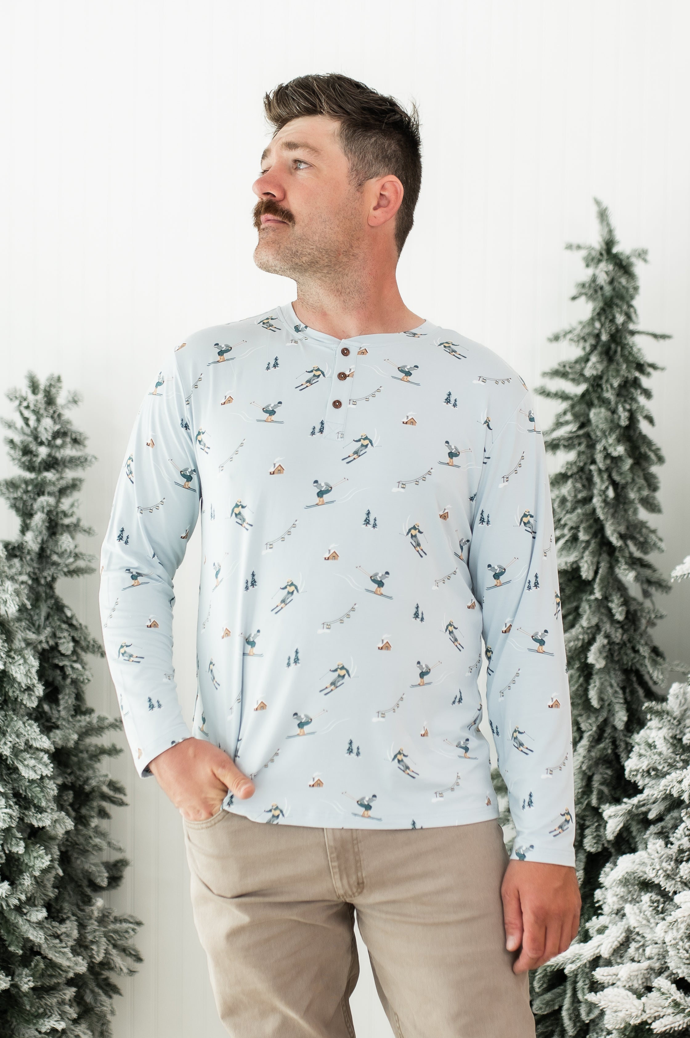 Male modeling the Men's Long Sleeve Henley Top in Ski 