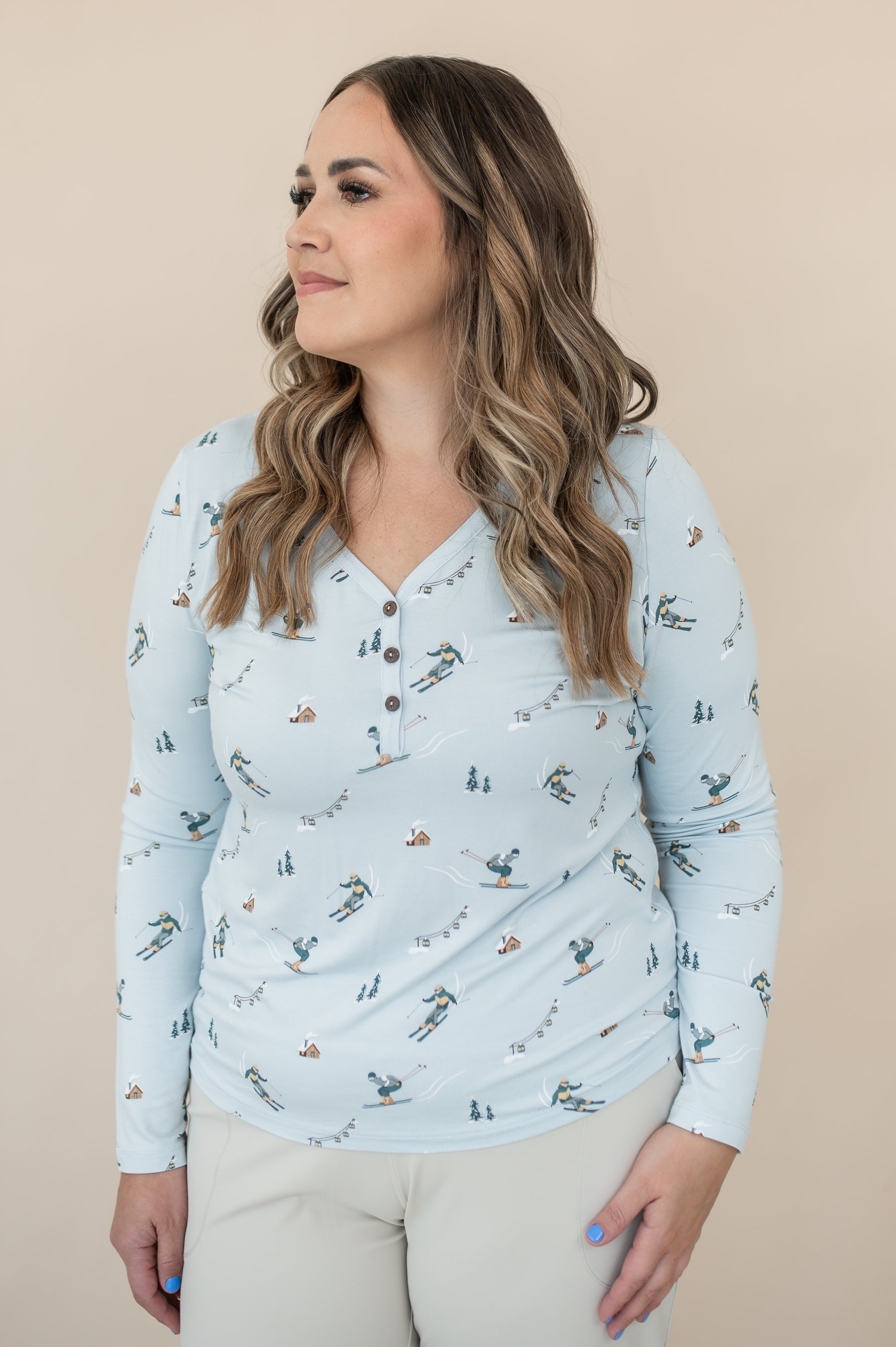 Female modeling the Women's Long Sleeve Henley Tee in Ski