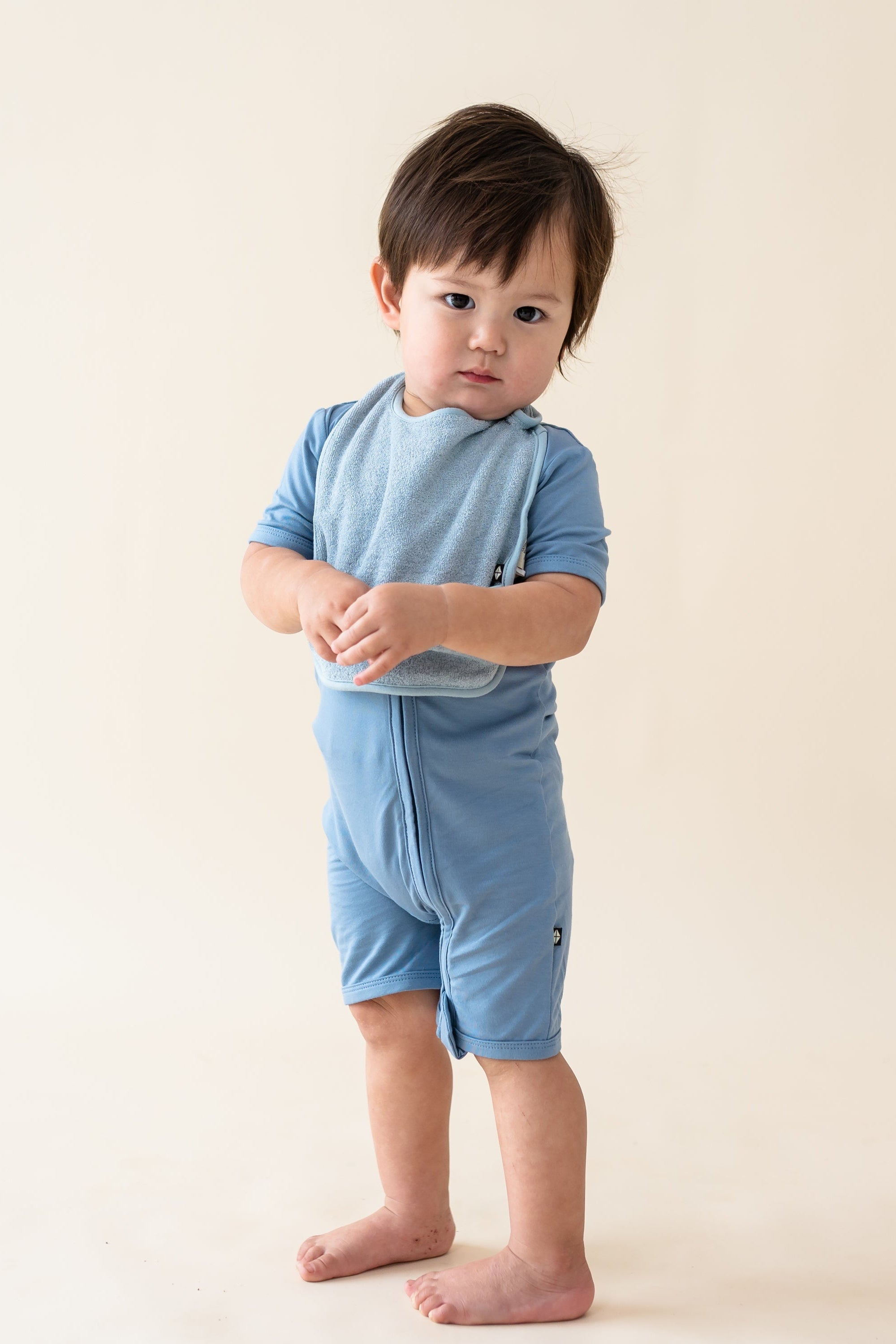 Toddler wearing Slate Blue Terry Pocket Bib with Adjustable Snaps