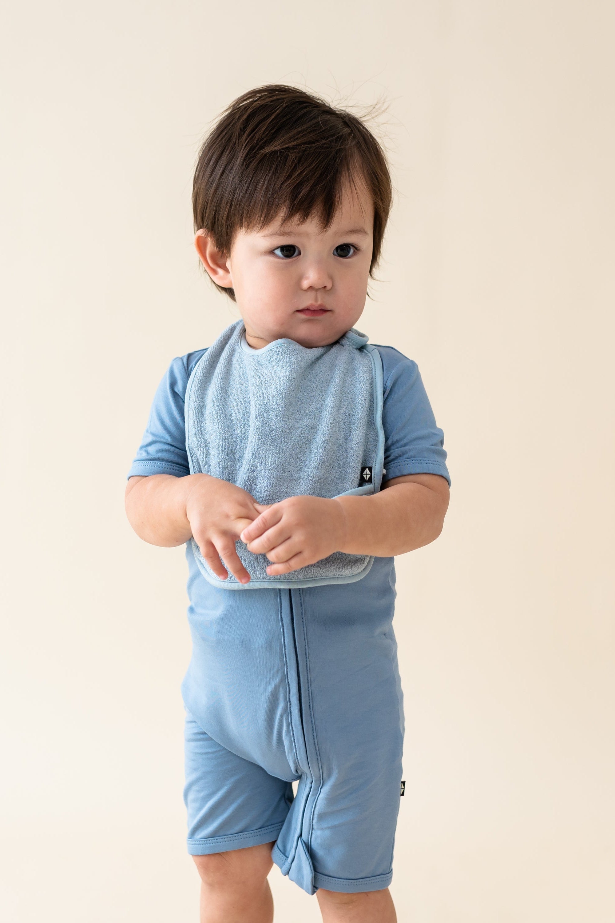 Toddler wearing Terry Pocket Bib in Slate
