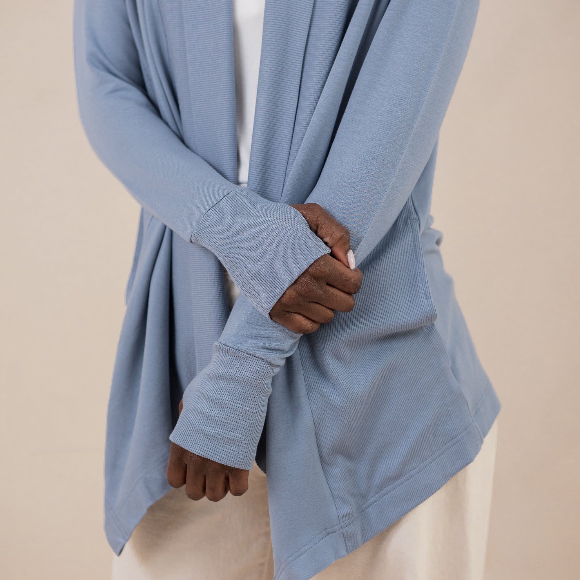 Close up of the rib knit cuffs with the thumbholes on the Women's French Terry Wrap Top in Slate