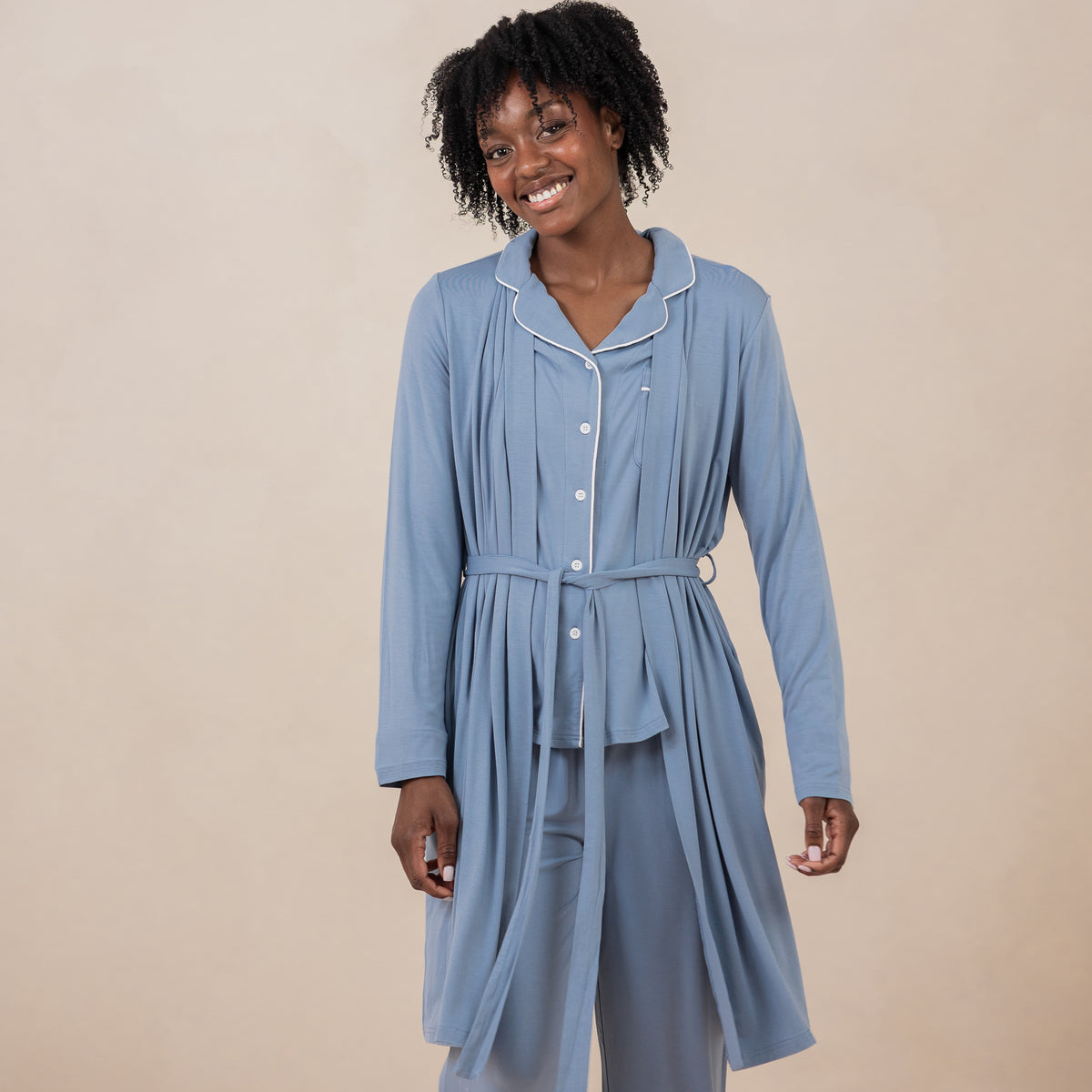 Female model wearing the Women's Lounge Robe in Slate showed tied in the front with matching long sleeve women's pajama set on underneath