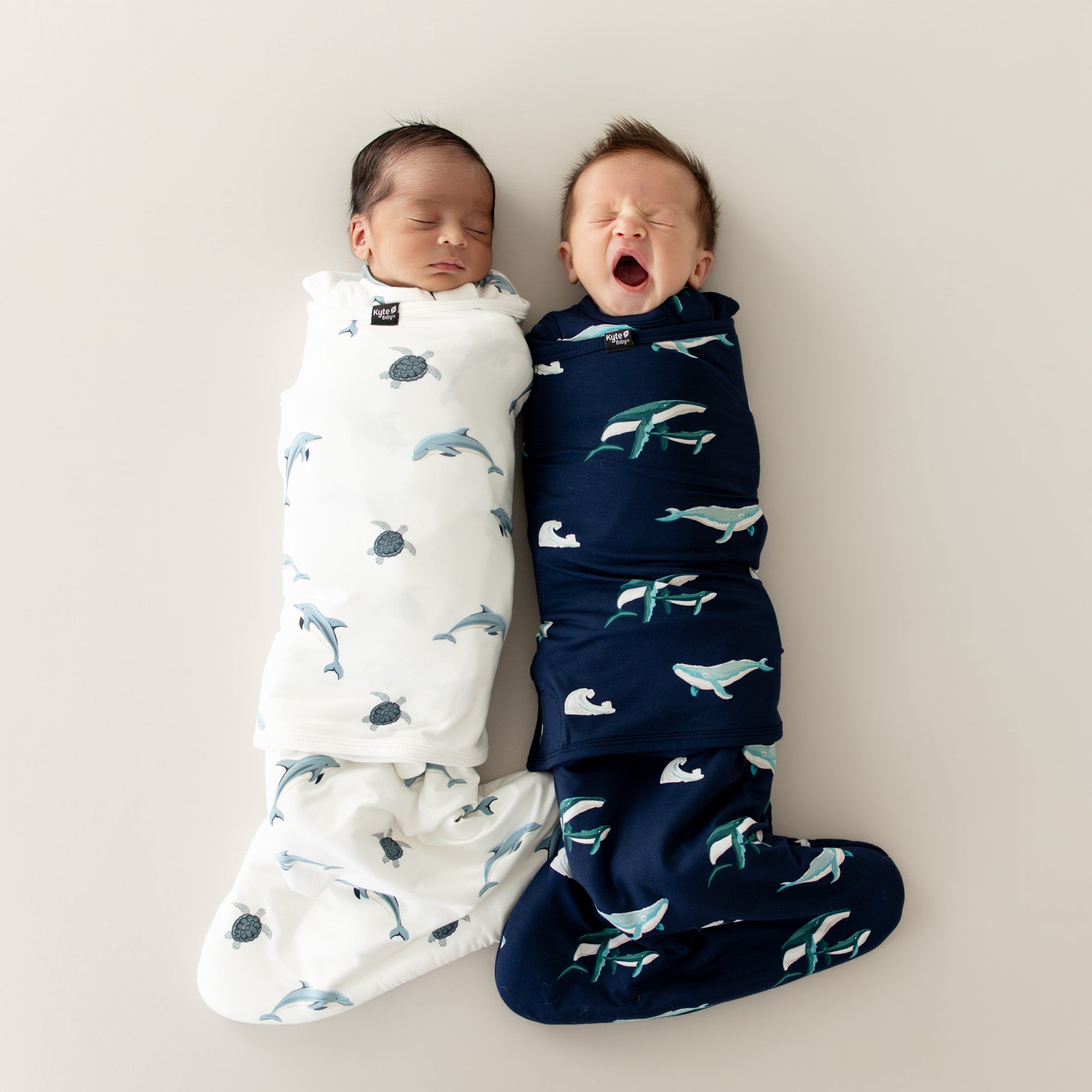 2 babies in Sleep Bag Swaddlers in Dolphin and Humpback