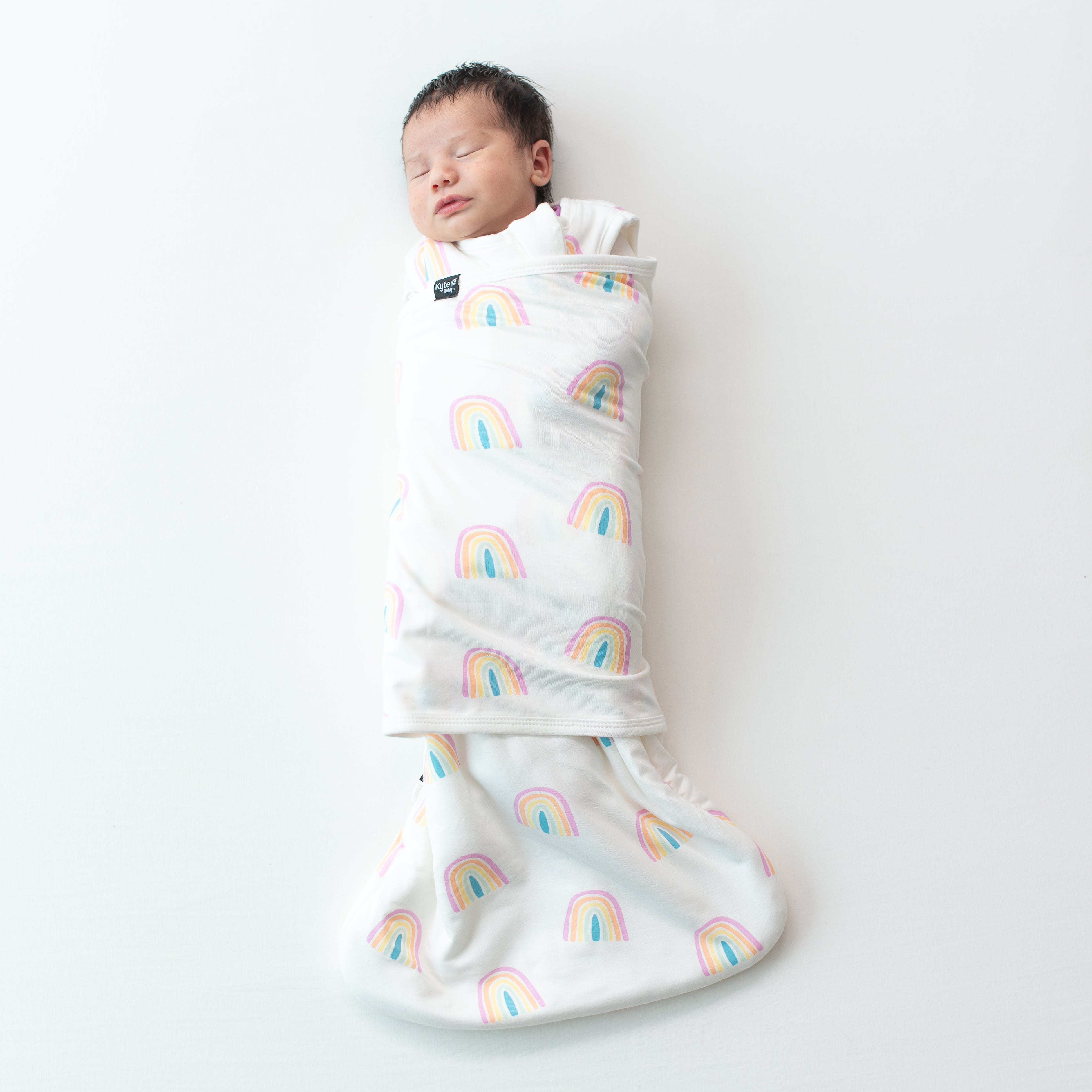 Baby asleep in Sleep Bag Swaddler in Poi Rainbow 1.0