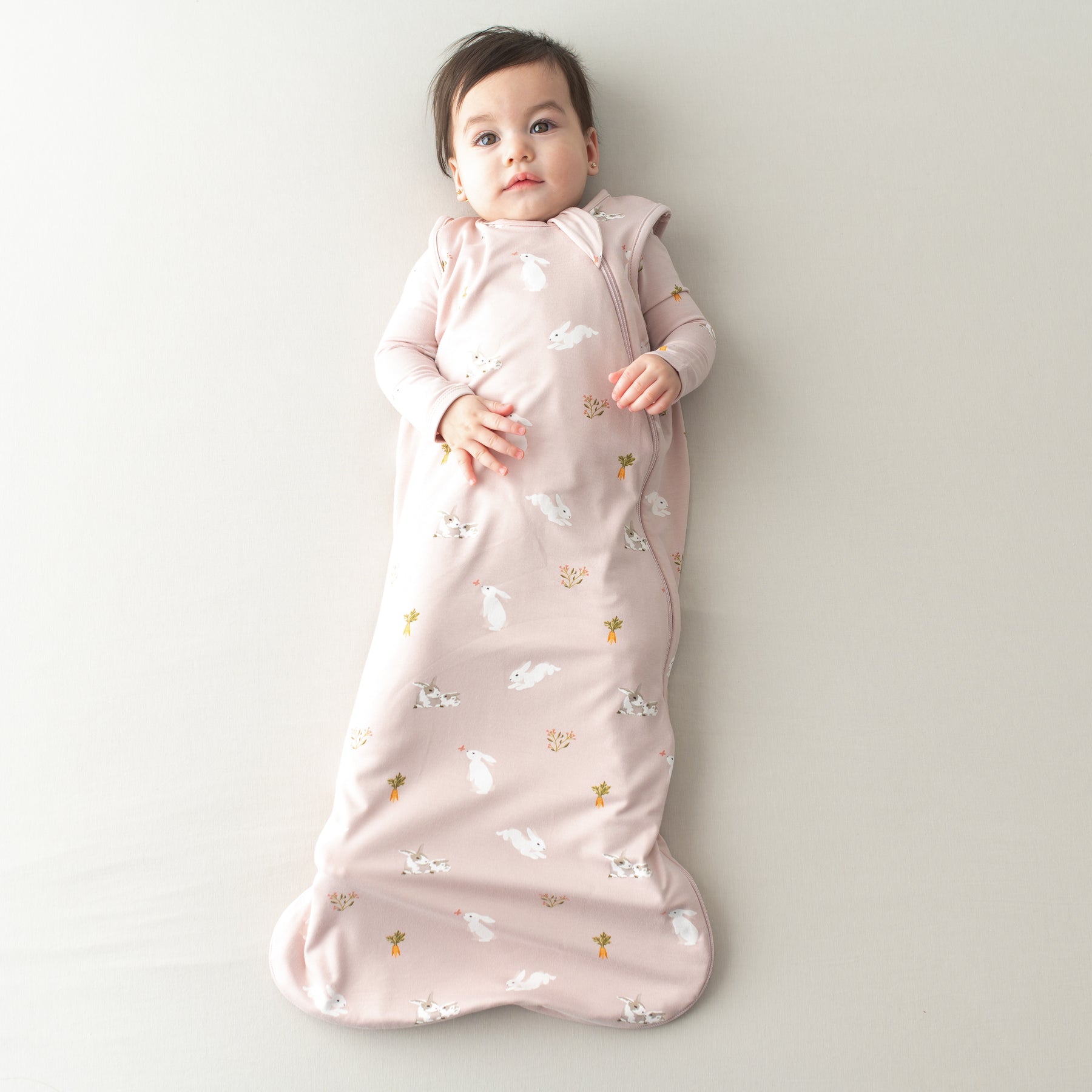 Baby in Sleep Bag in Blush Rabbit 0.5