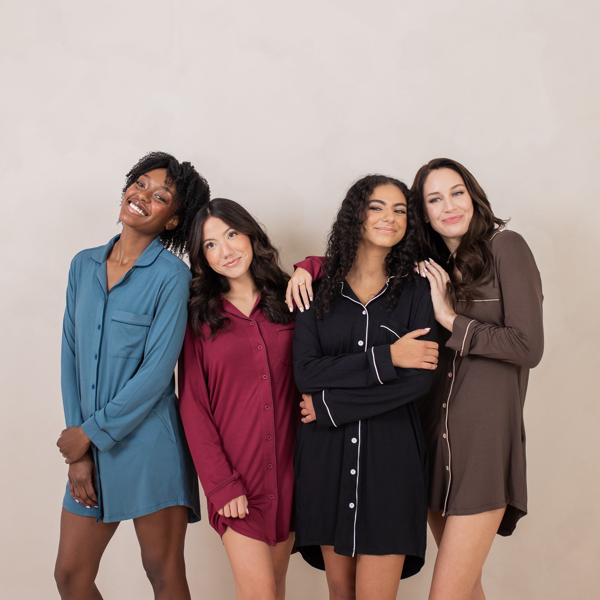 Group of women standing side by side wearing the Long Sleeve Women’s Nightshirt in Espresso, Midnight, Espresso and Atlantic
