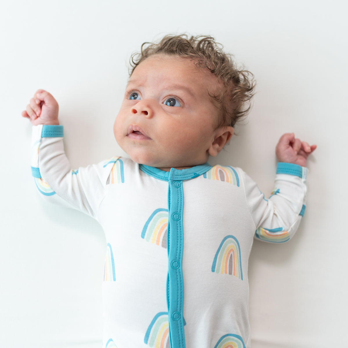 Baby wearing Makai Rainbow Snap Footie