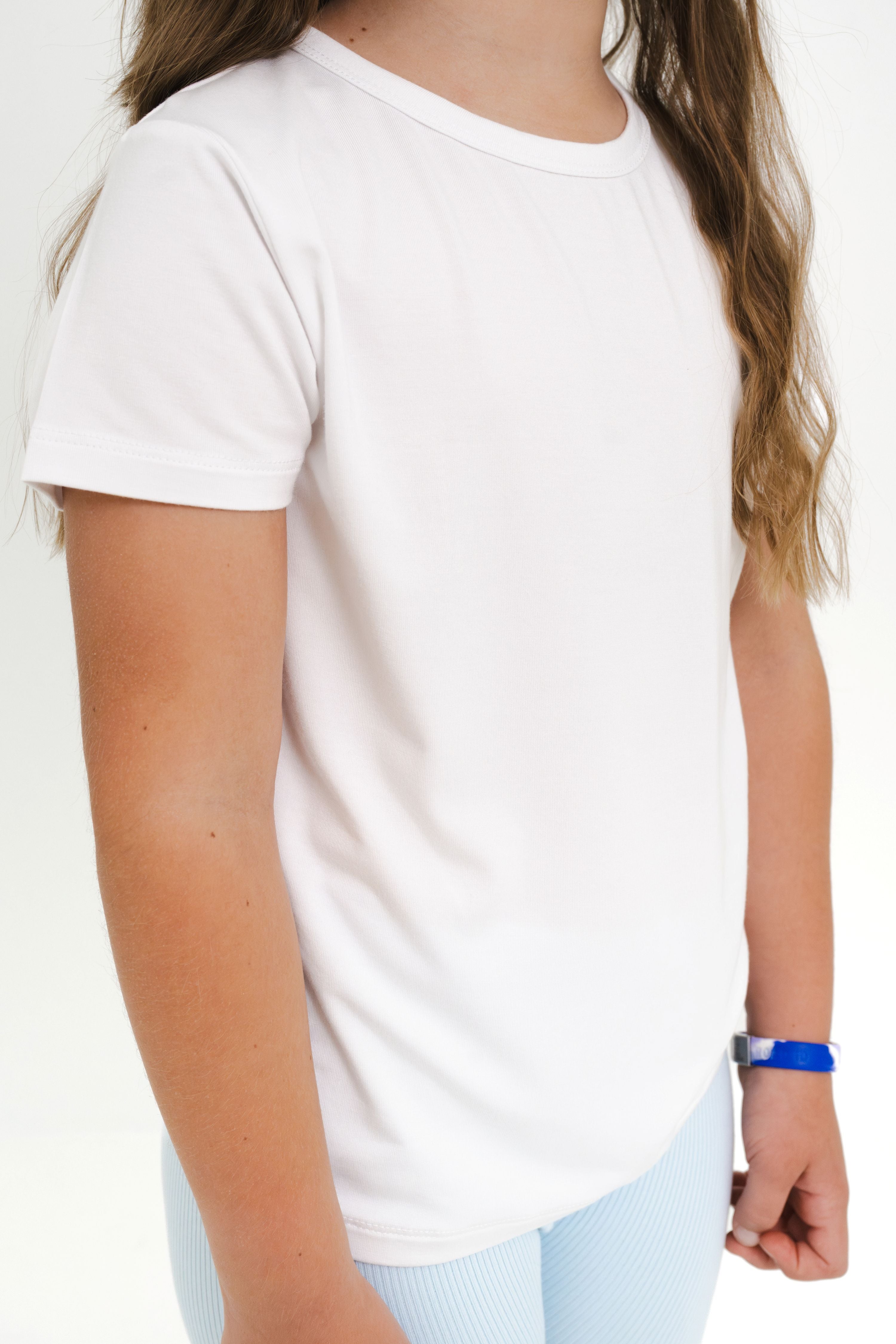 Close up of the Toddler Basic Tee in Snow shown on a model