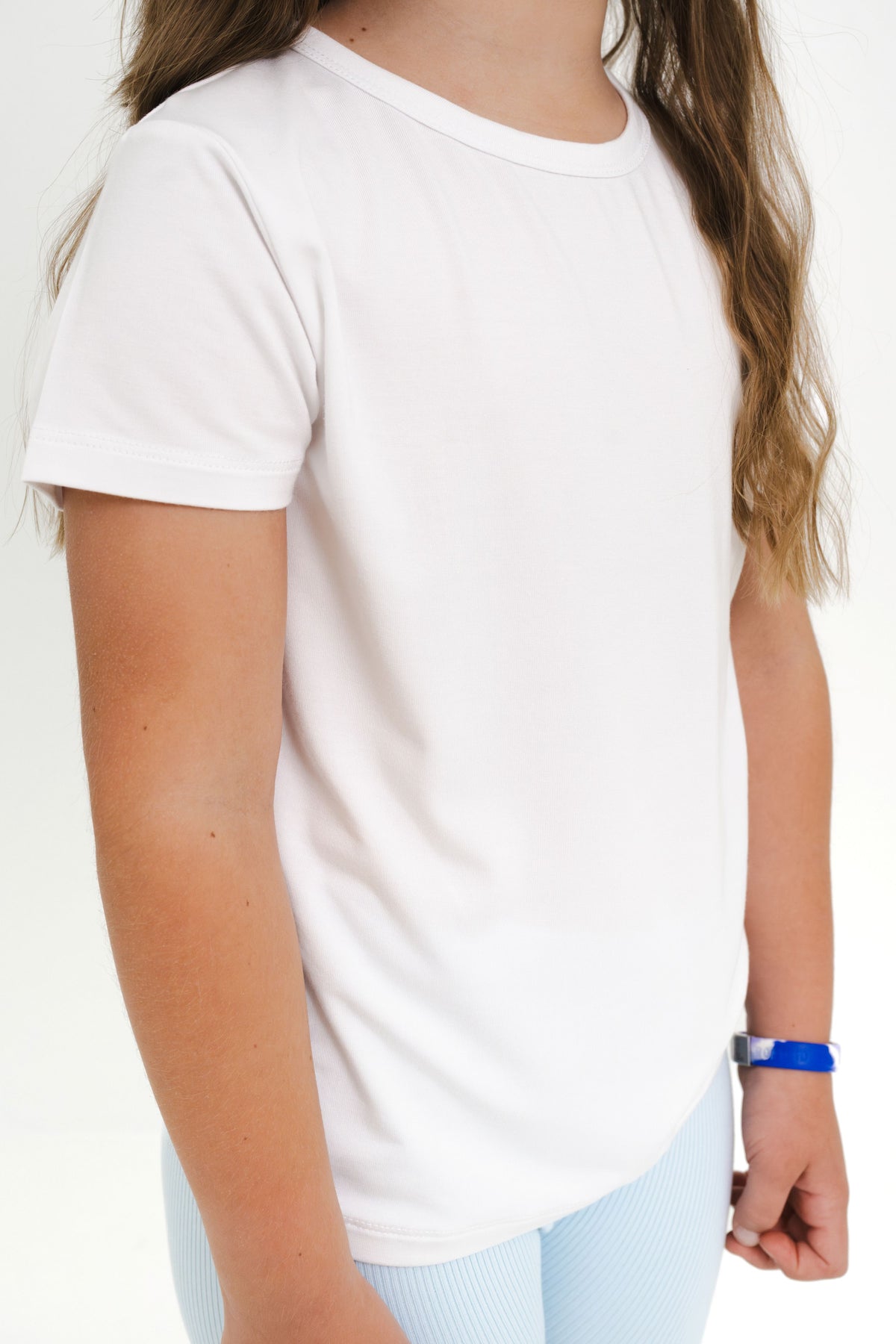 Close up of the Toddler Basic Tee in Snow shown on a model