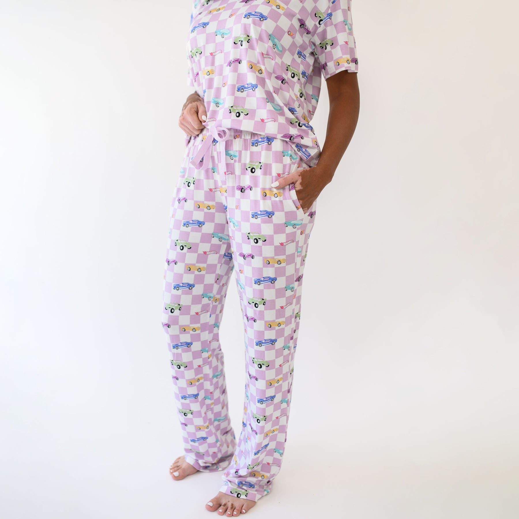 Woman modeling Women's Lounge Pants in Sparkles and Speed showing close up of the pants with pockets