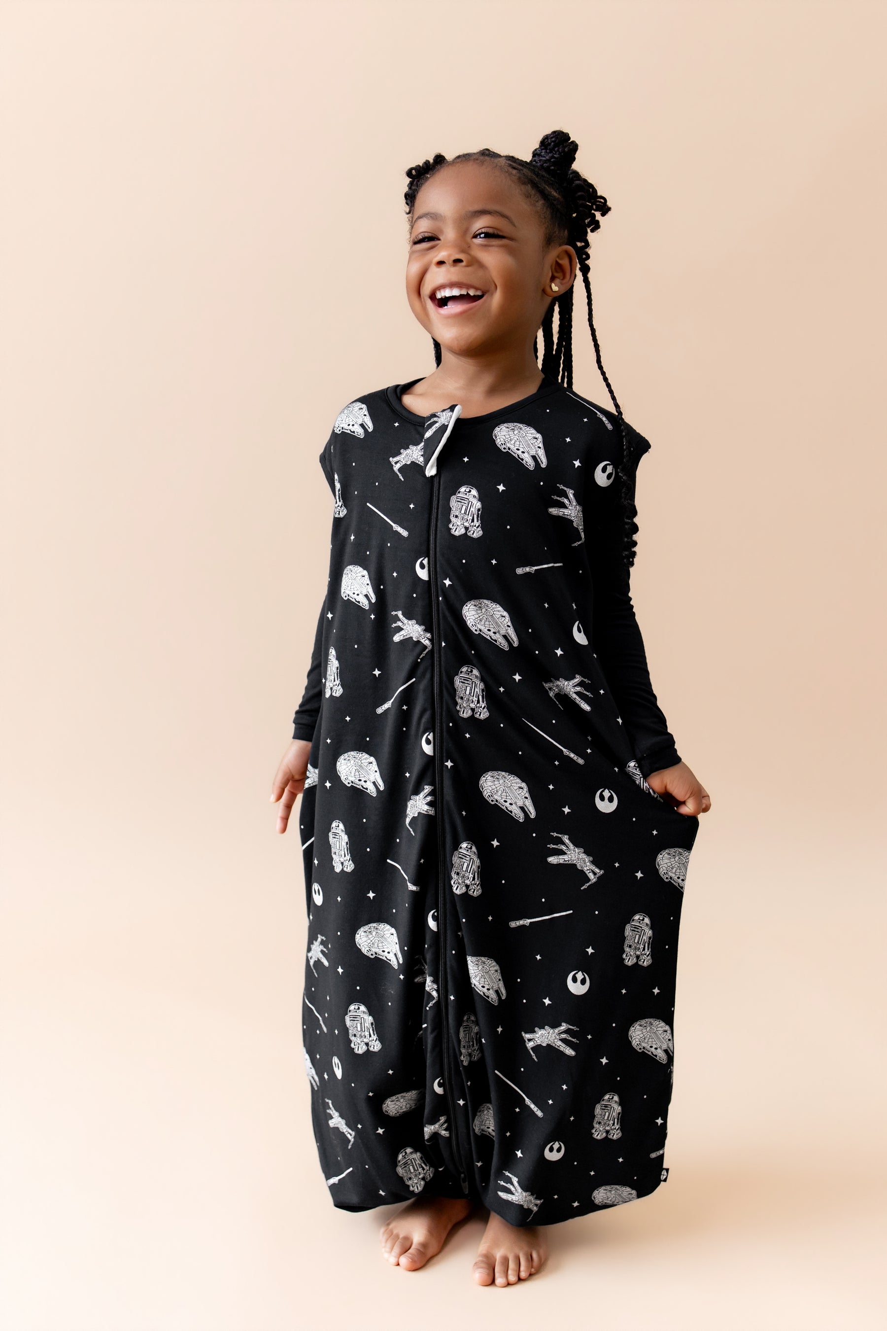 Smiling girl modeling the Sleep Bag Walker in STAR WARS™ 1.0