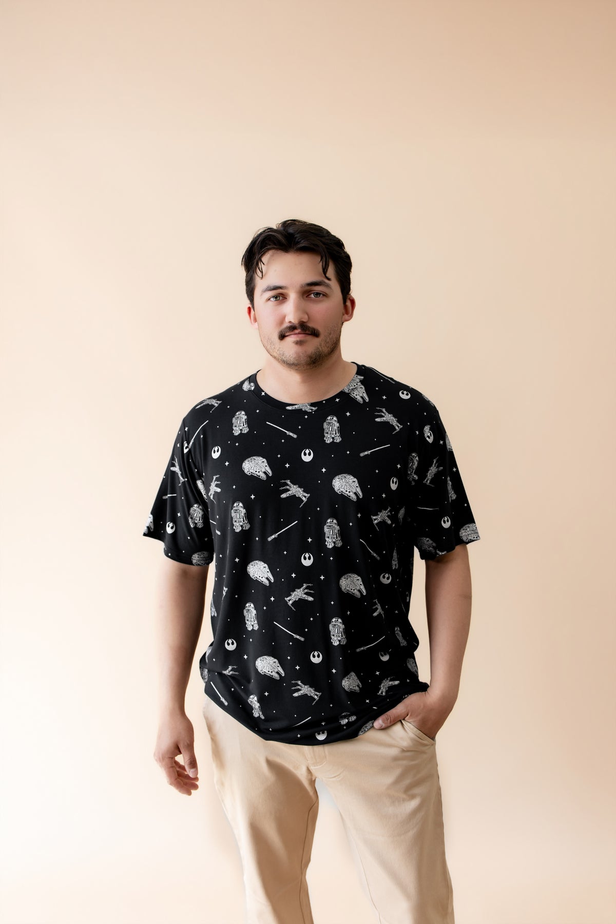 Male modeling the Men's Crew Neck Tee in STAR WARS™ paired with tan pants