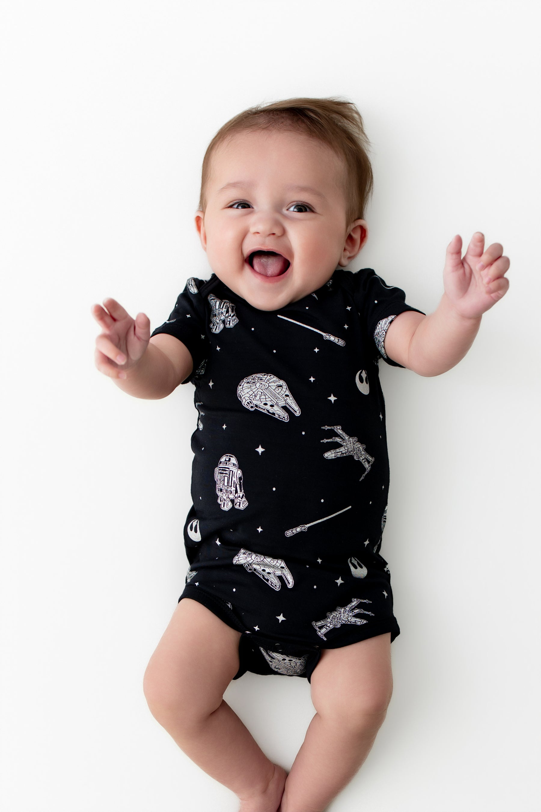 Smiling baby wearing the Bodysuit in STAR WARS™