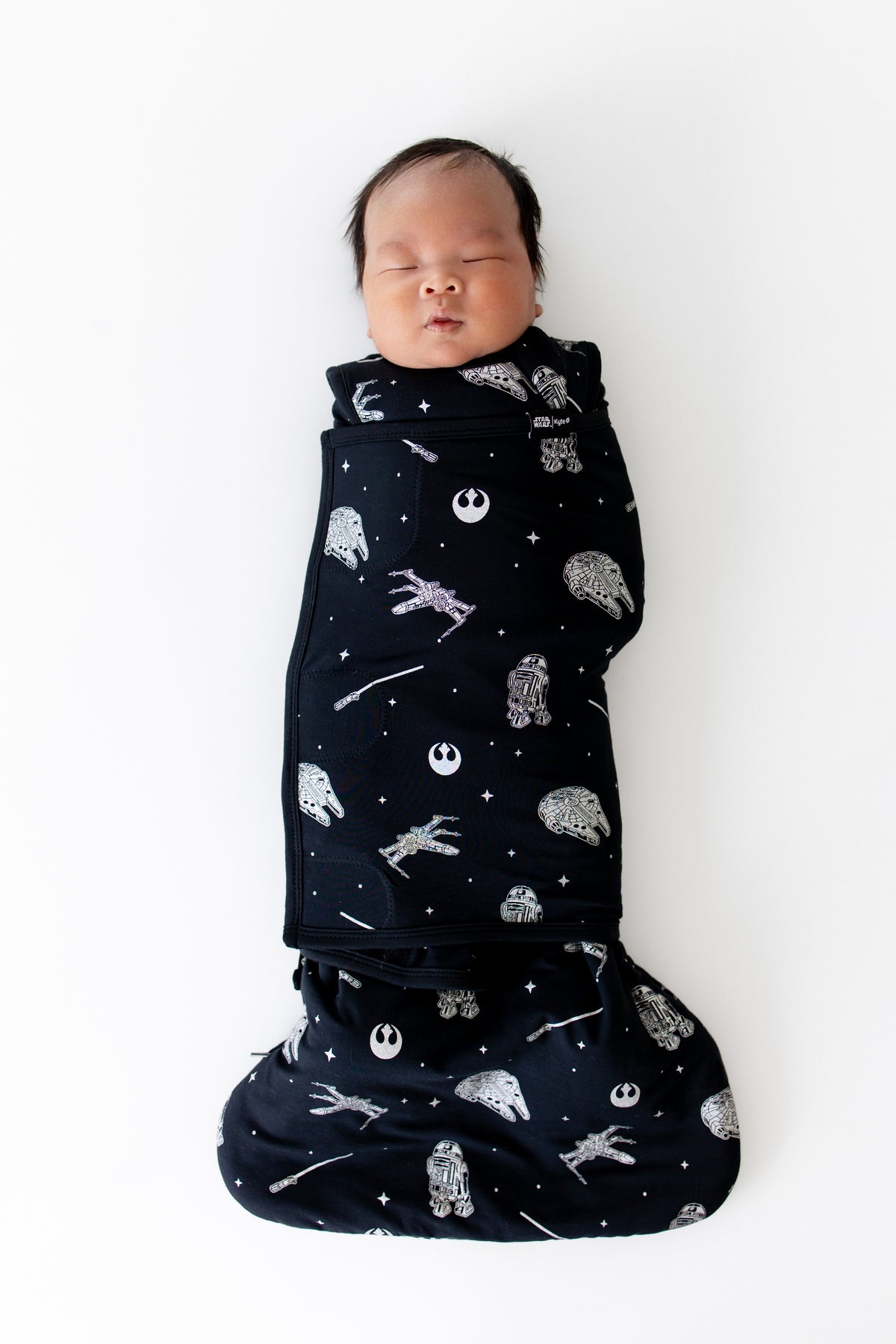 Sleeping newborn swaddled in the Sleep Bag Swaddler in STAR WARS™ 1.0