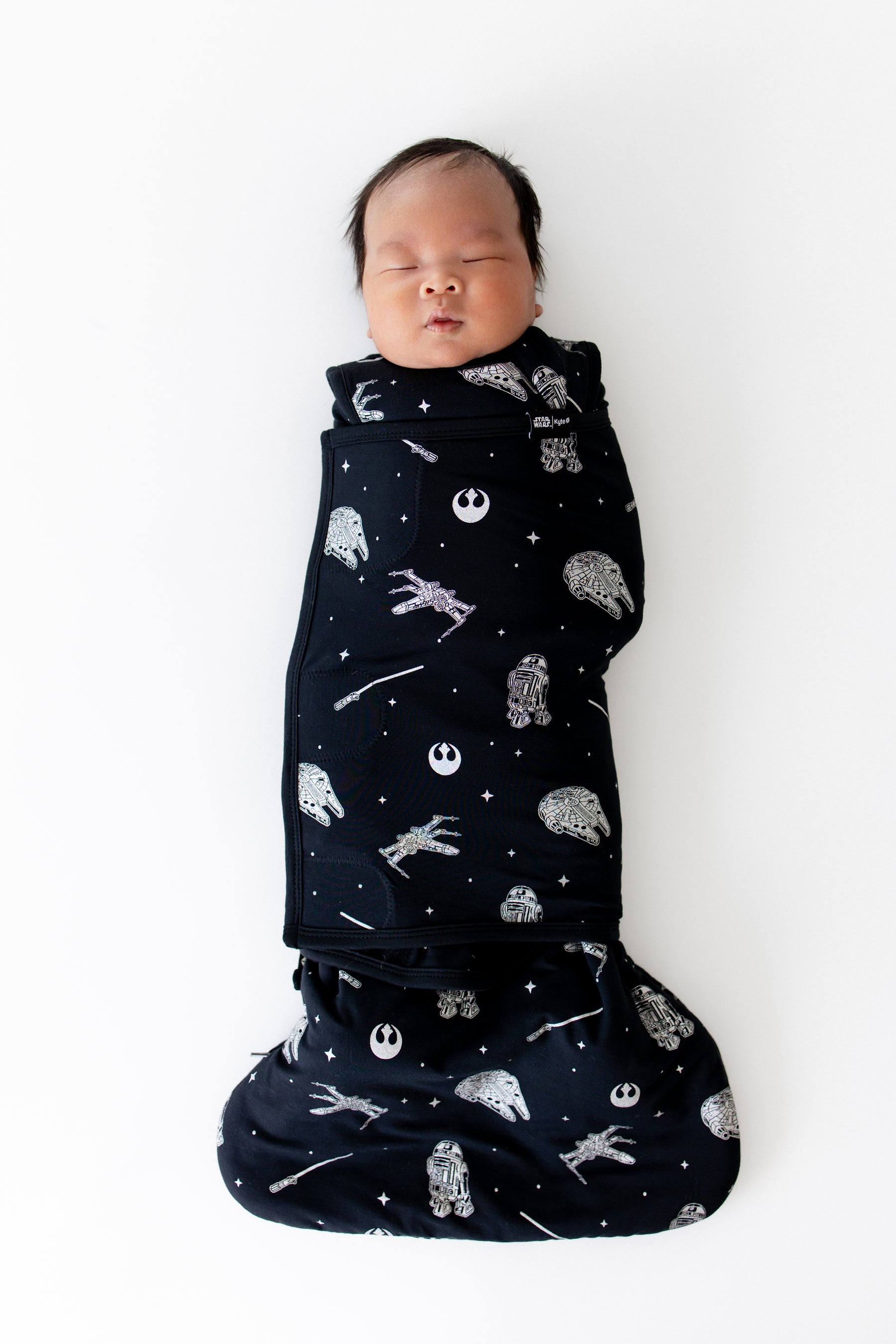Sleeping newborn swaddled in the Sleep Bag Swaddler in STAR WARS™ 1.0