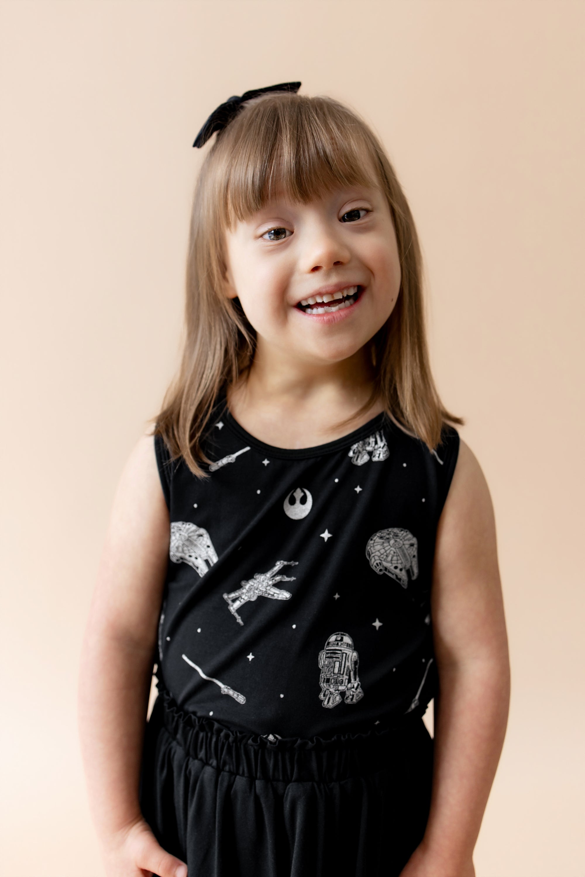 Young girl wearing the Toddler Tank Top in STAR WARS™ paired with a black skort