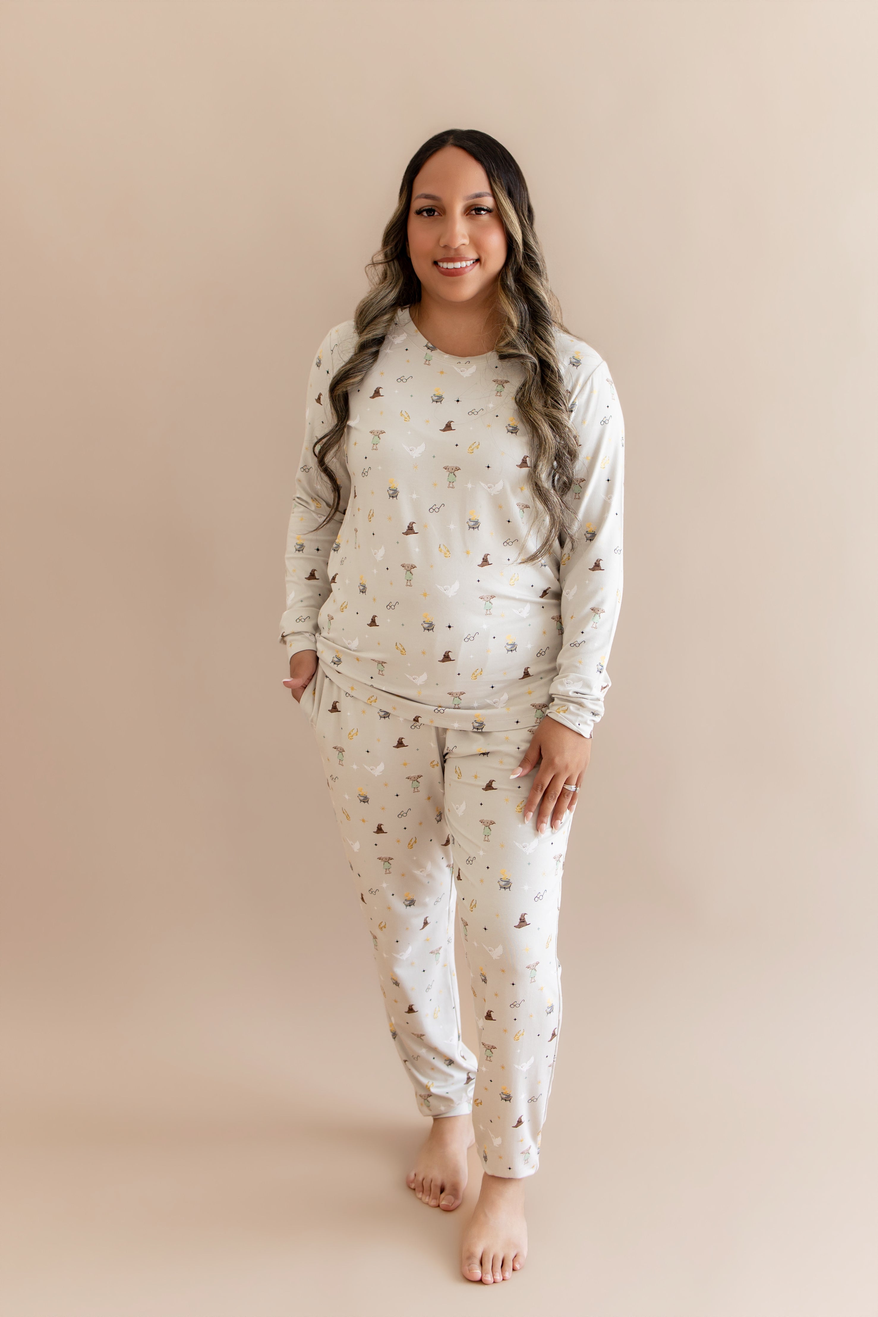 Women wearing a cream joggers set with Harry Potter prints on a beige background