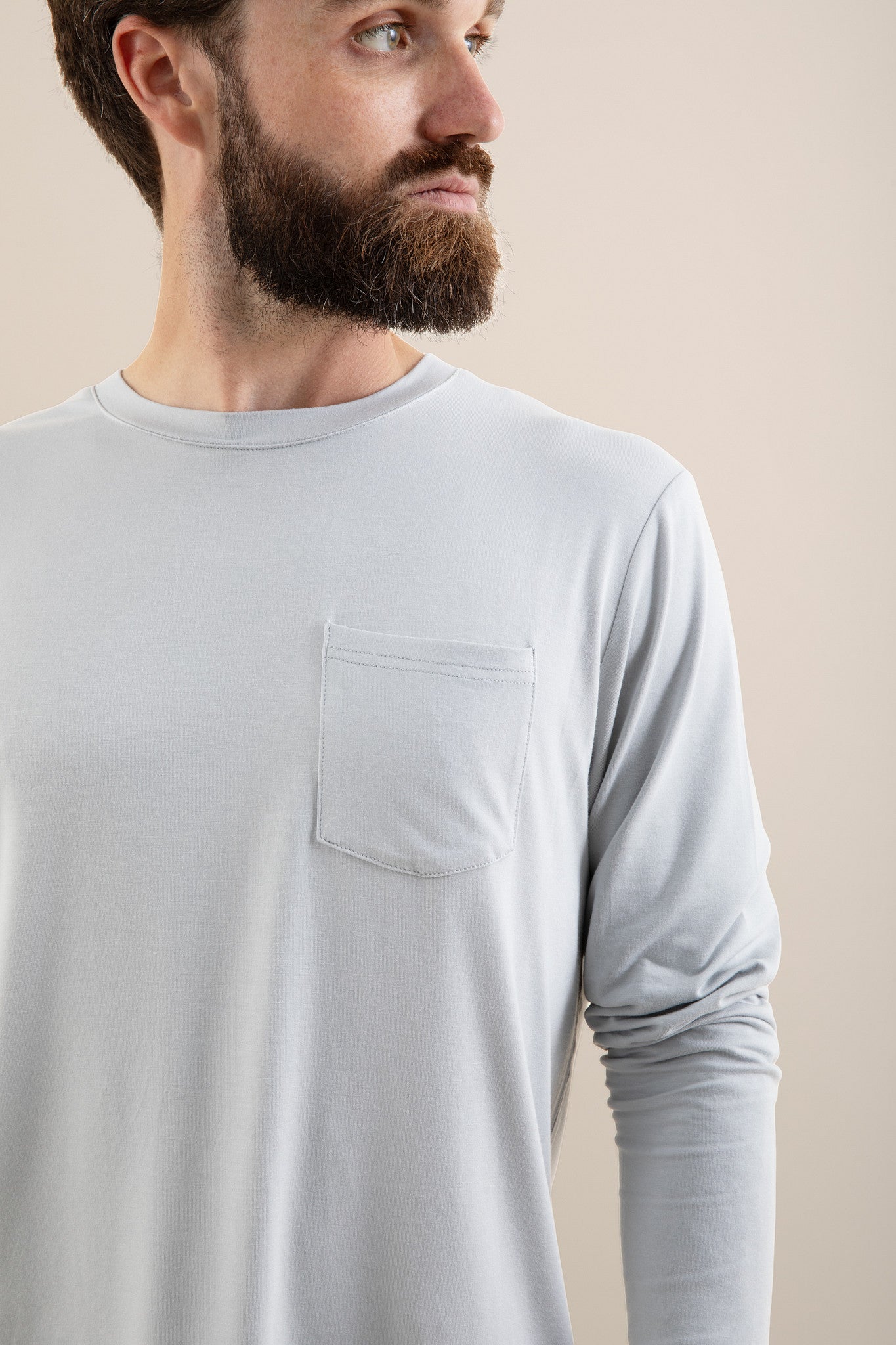 Chest pocket detail of the shirt of the Men's Jogger Set in Storm shown on a male model