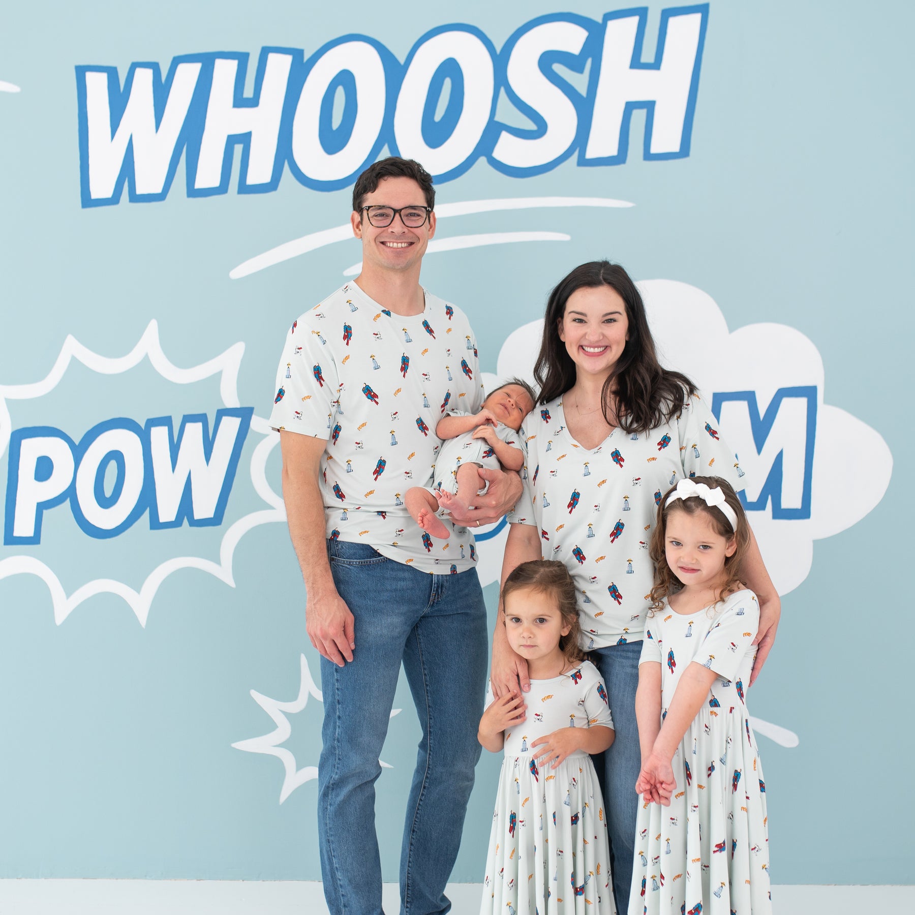 Family of five wearing various items from the Superman™ collection