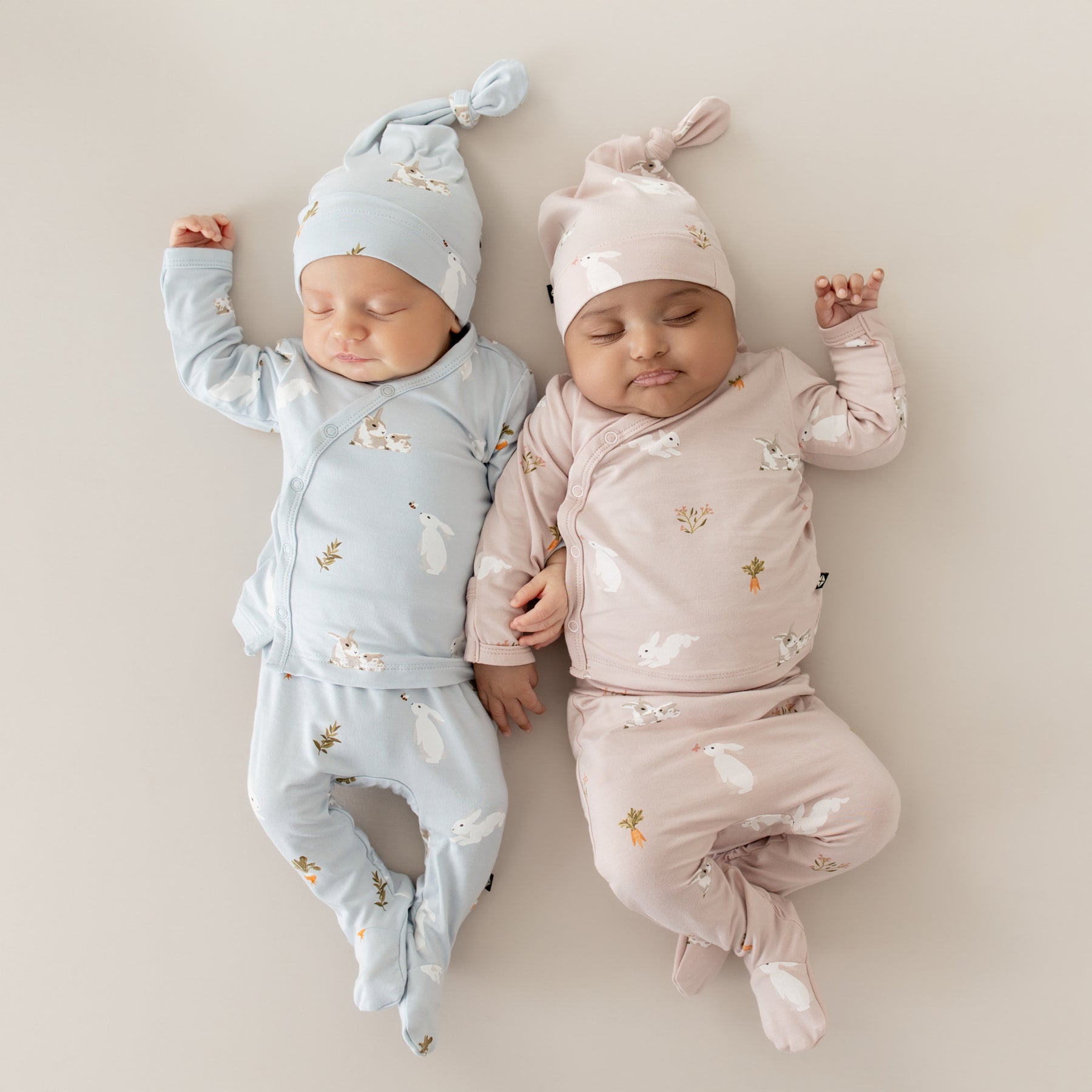 2 babies wearing Take Me Home Set with Cap in Blush Rabbit and Ice Rabbit