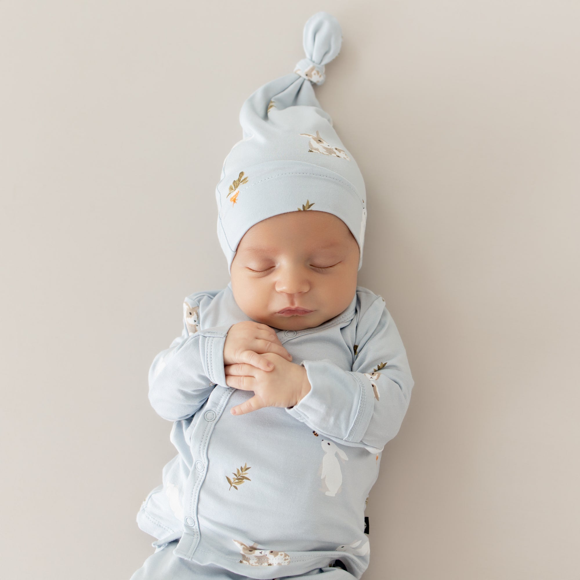 close up of baby in Take Me Home Set with Cap in Ice Rabbit