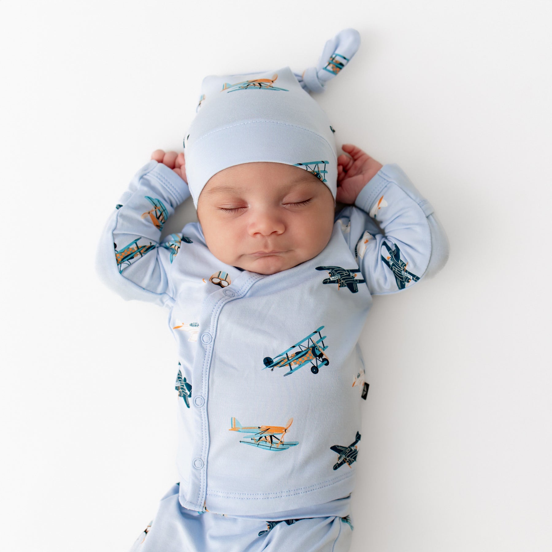 Close up of sleeping newborn wearing the Take Me Home Set with Cap in Take Off