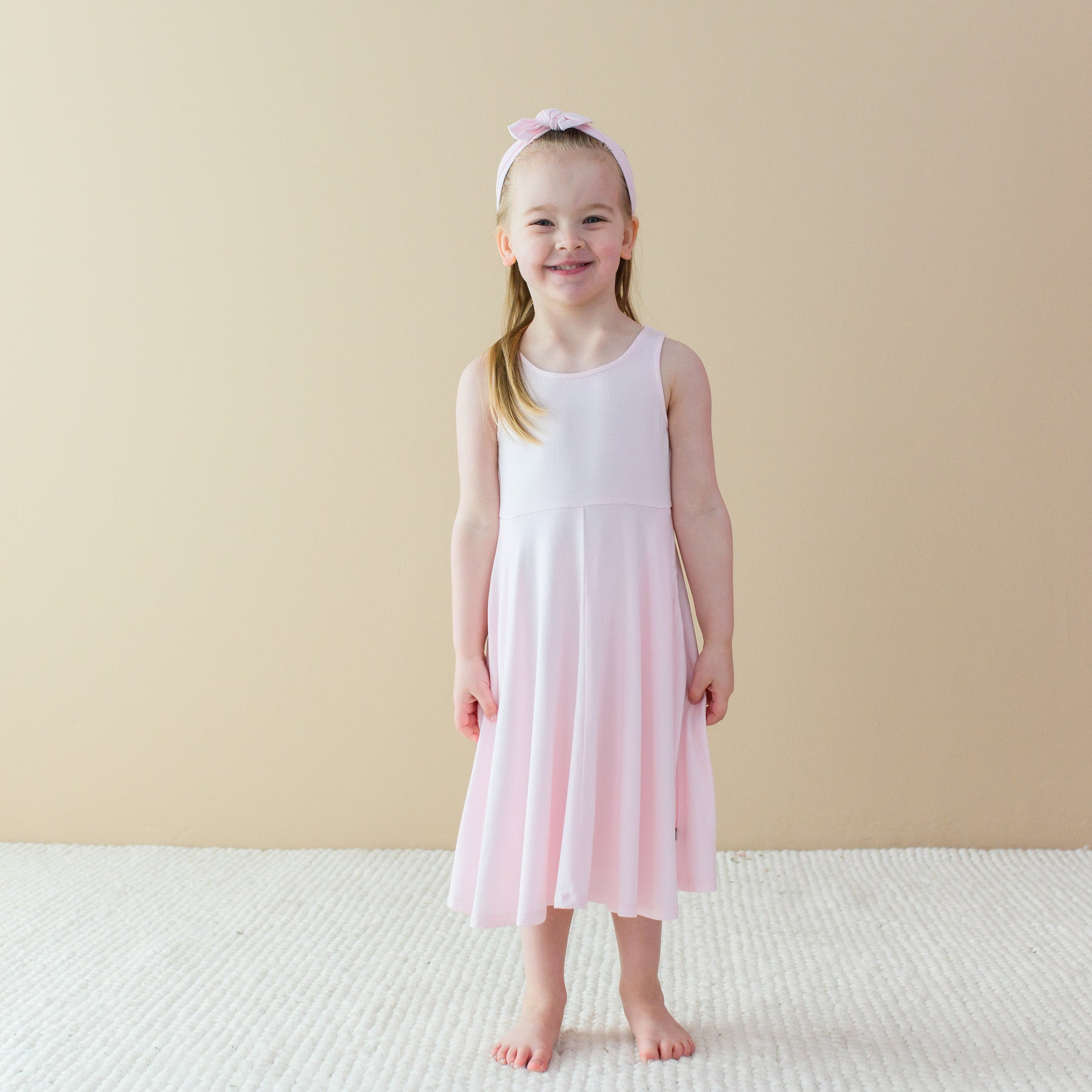 Child modeling Tank Twirl Dress in Sakura