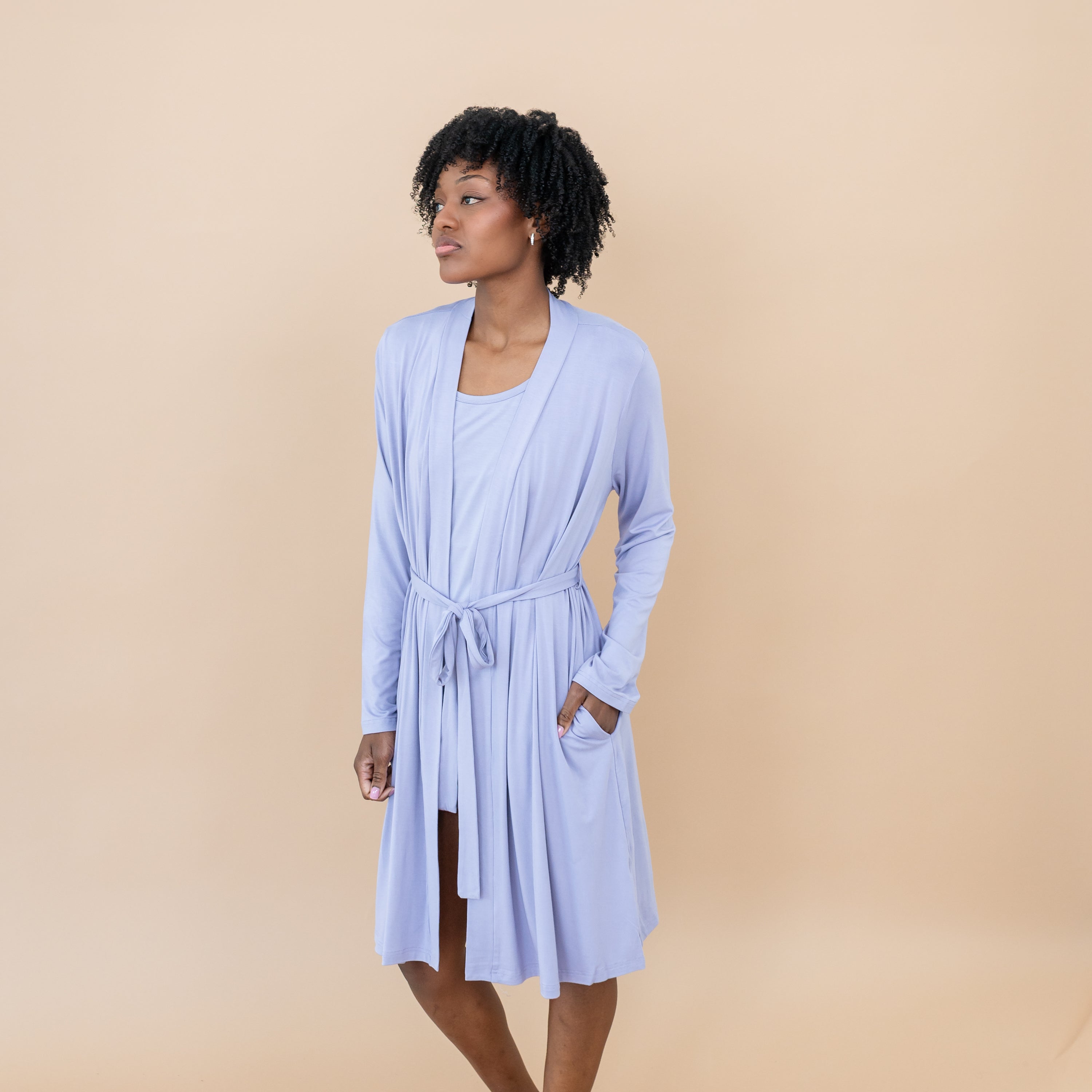 Female wearing the Women’s Lounge Robe in Taro with one hand in the robe pocket