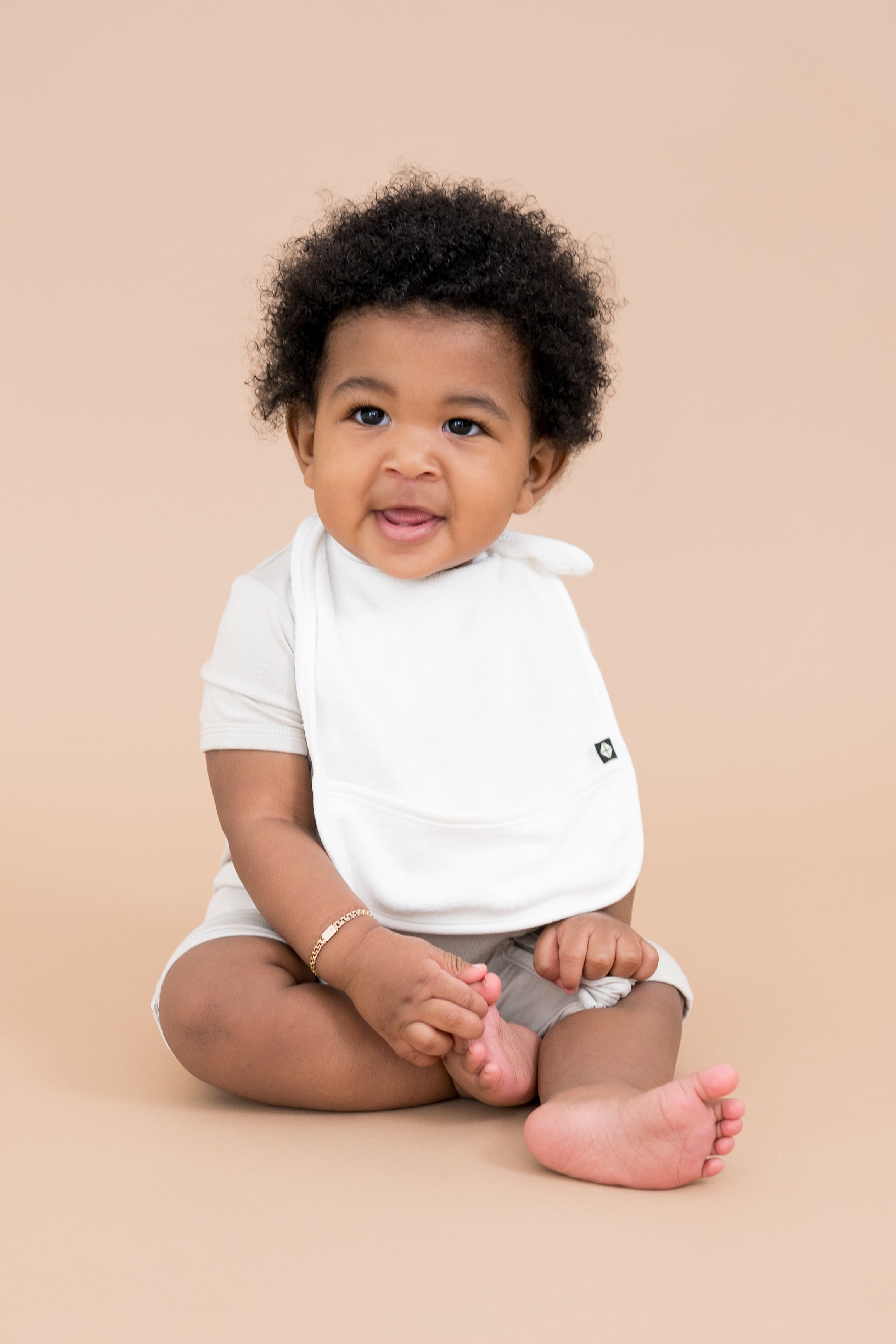 Baby wearing Terry Pocket Bib in Cloud