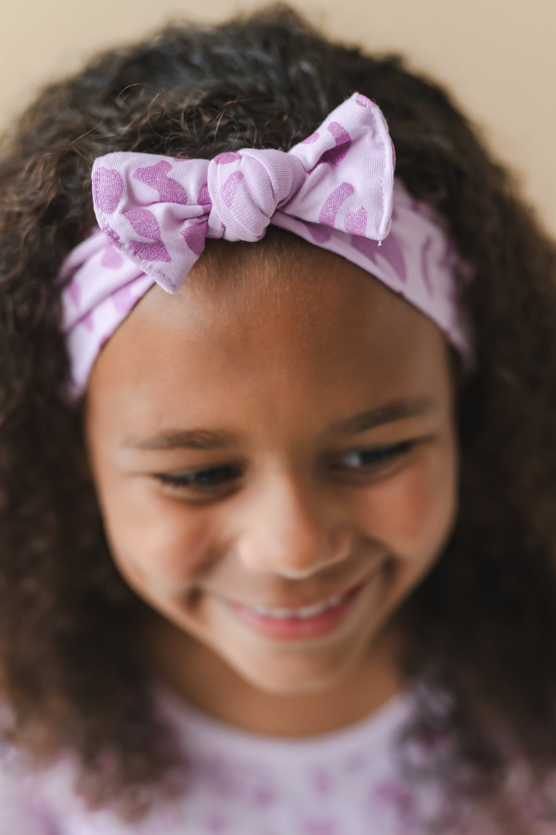 Child wearing a Thistle Leopard print Knotted Bow headband