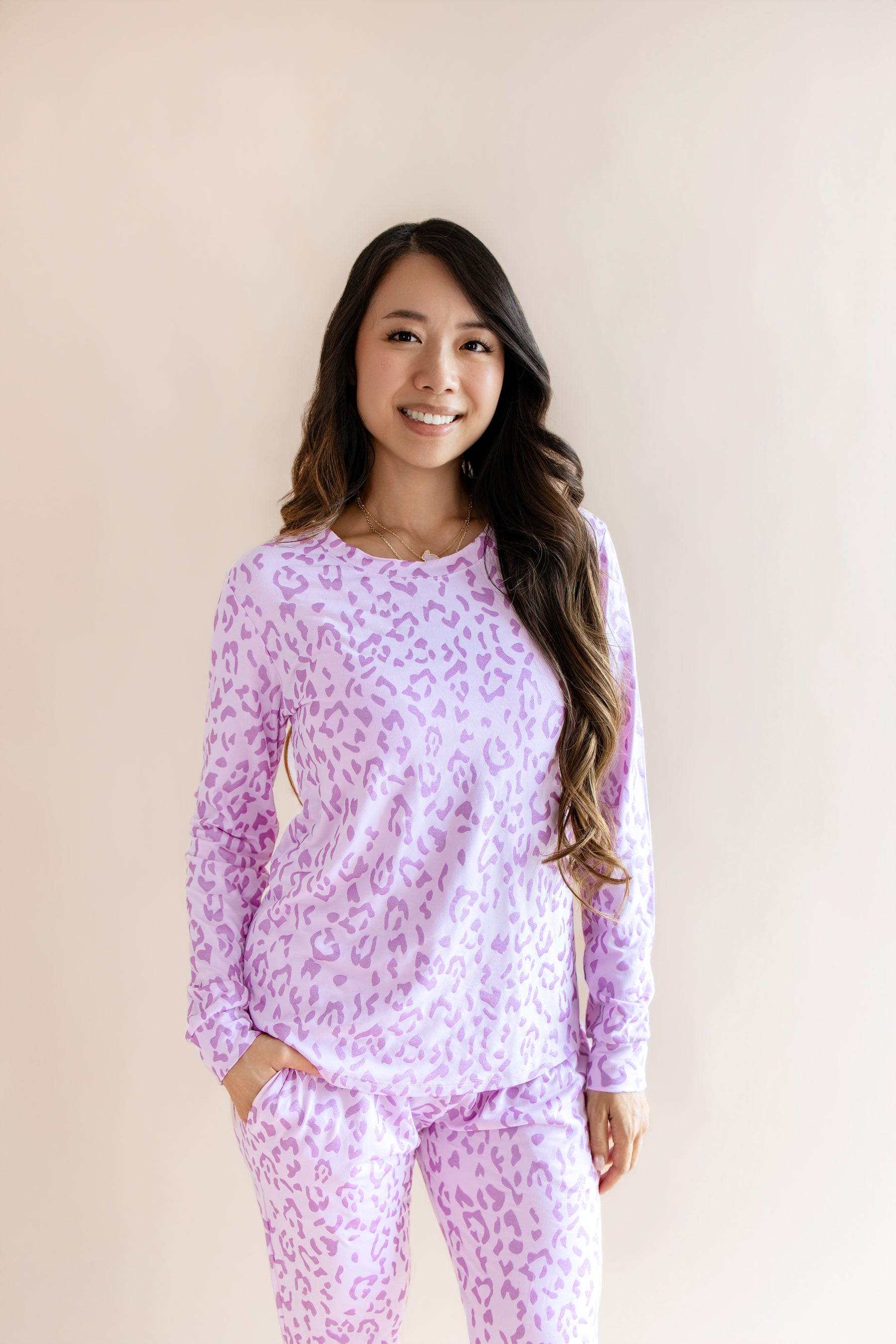 Model wearing Women's Jogger pajama set in Thistle Leopard print on a beige background
