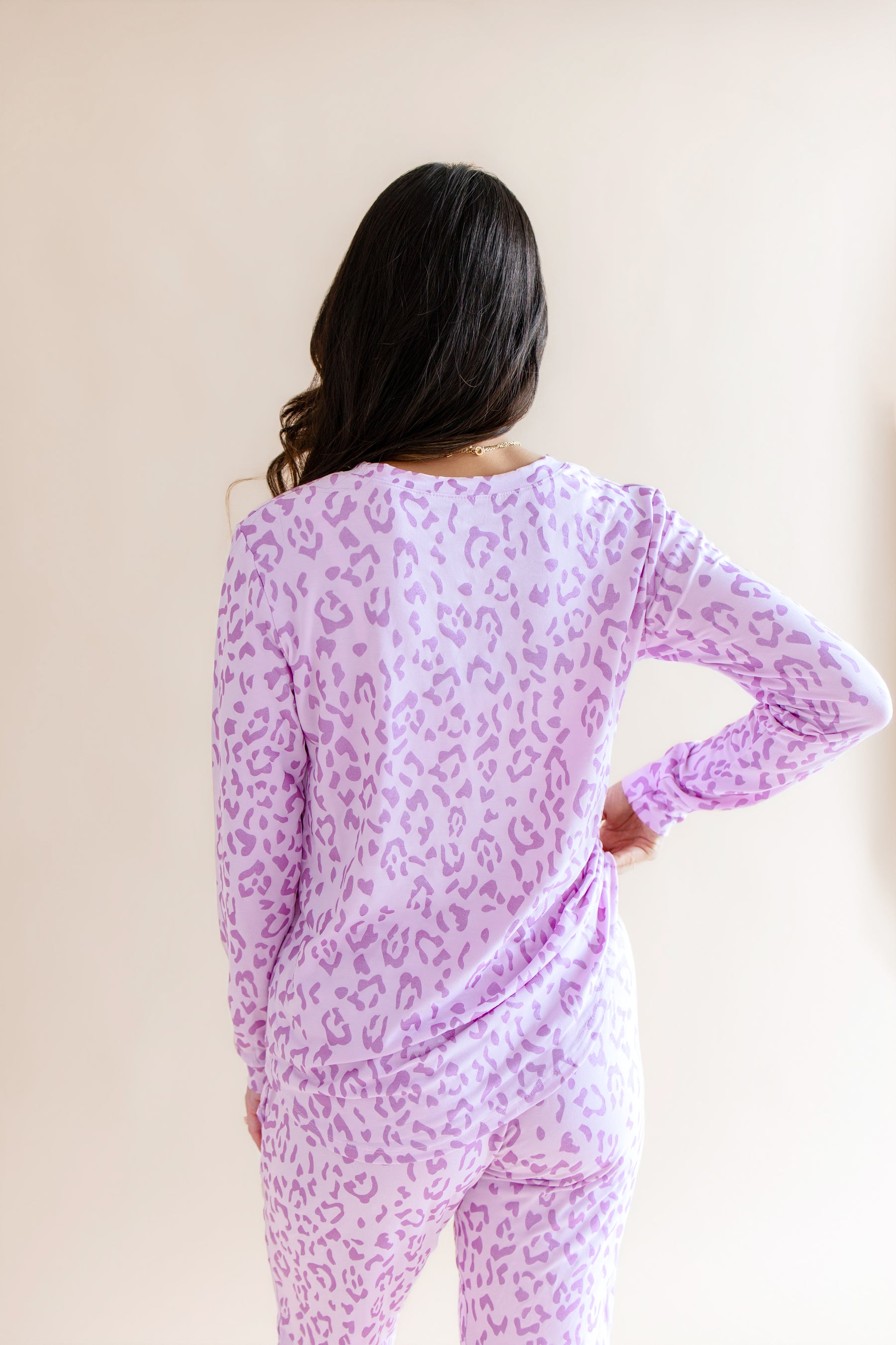 Back side of Women's Jogger pajama set in Thistle Leopard print on a beige background