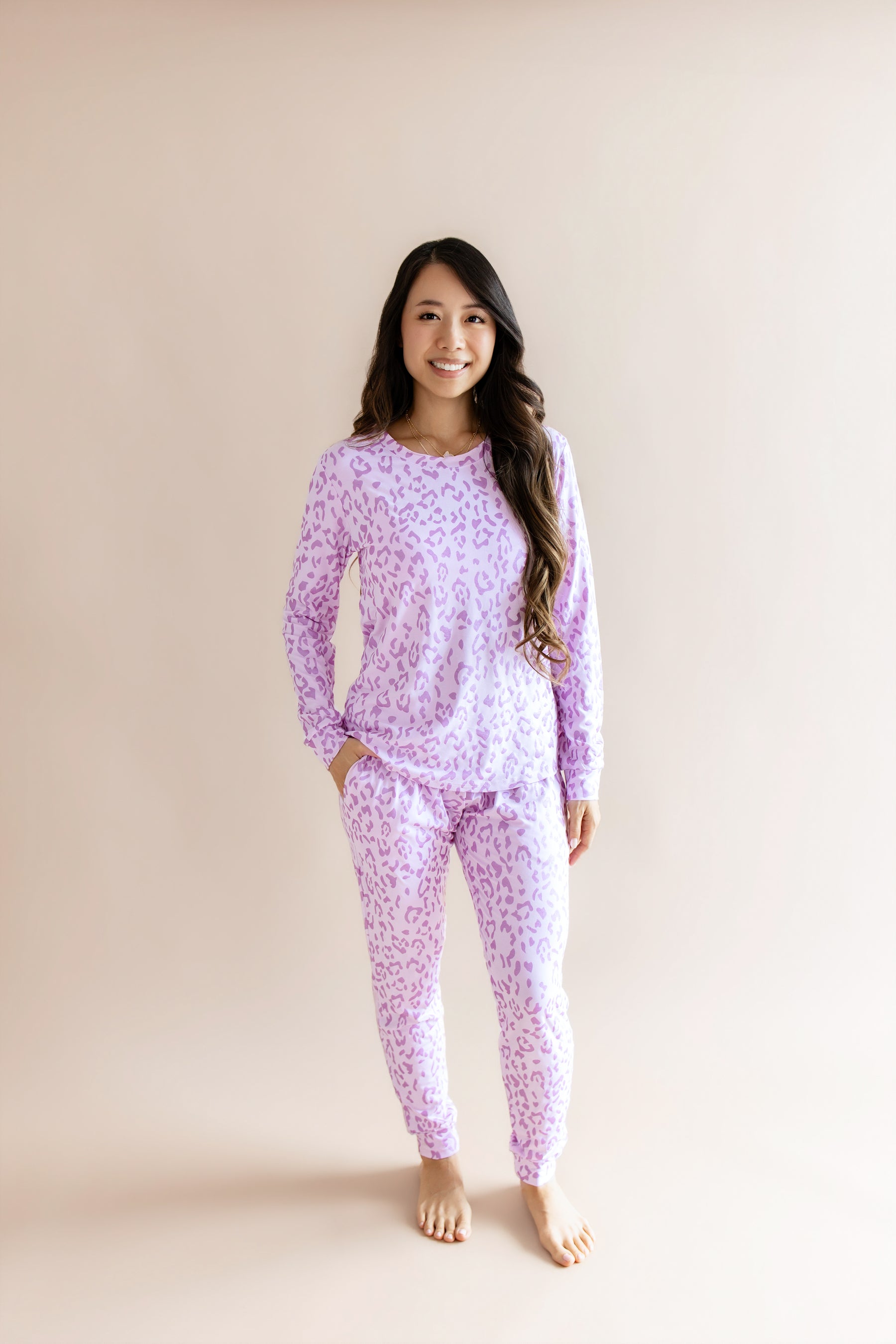 Model wearing Women's Jogger pajama set in Thistle Leopard print on a beige background