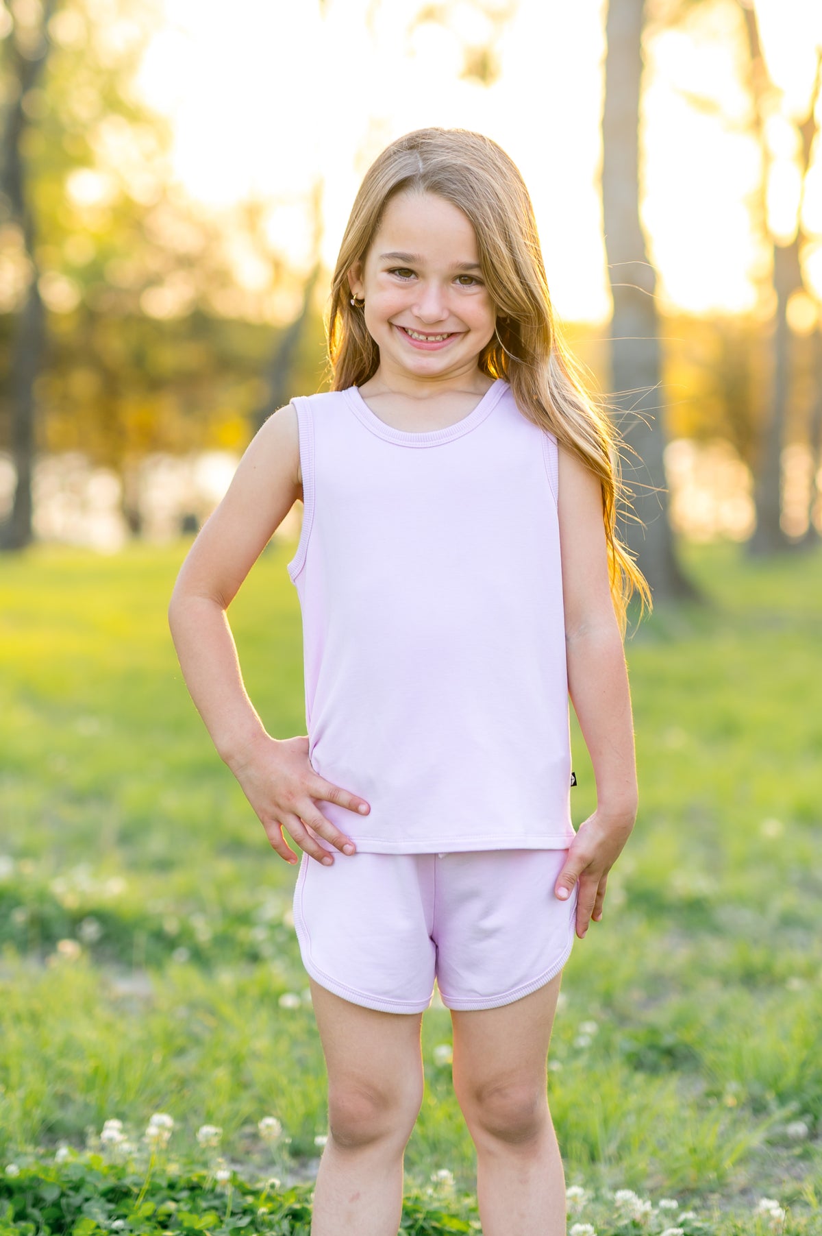 Young girl posing wearing the Tank Jogger Set in Thistle