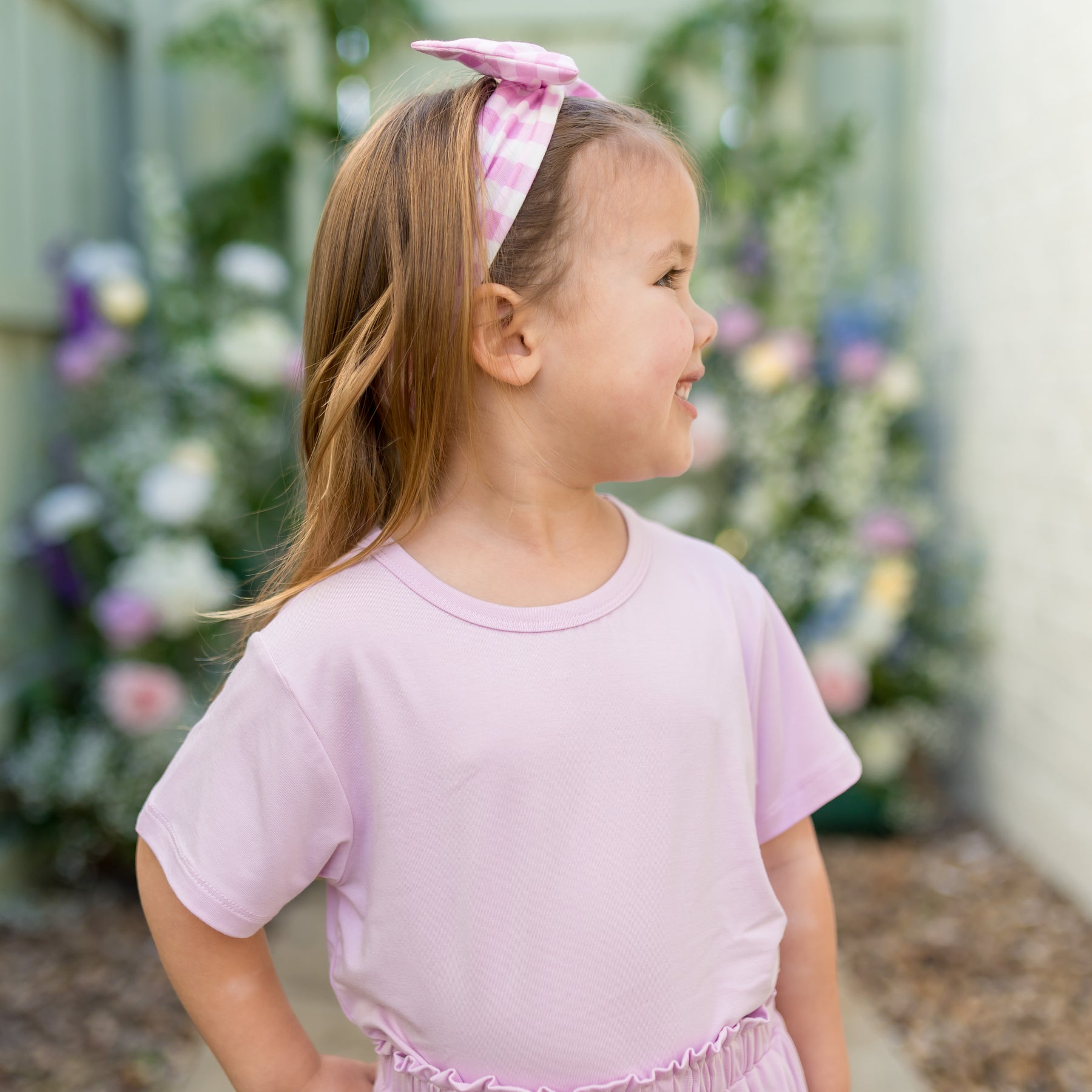 Young girl modeling the Toddler Basic Tee in Thistle