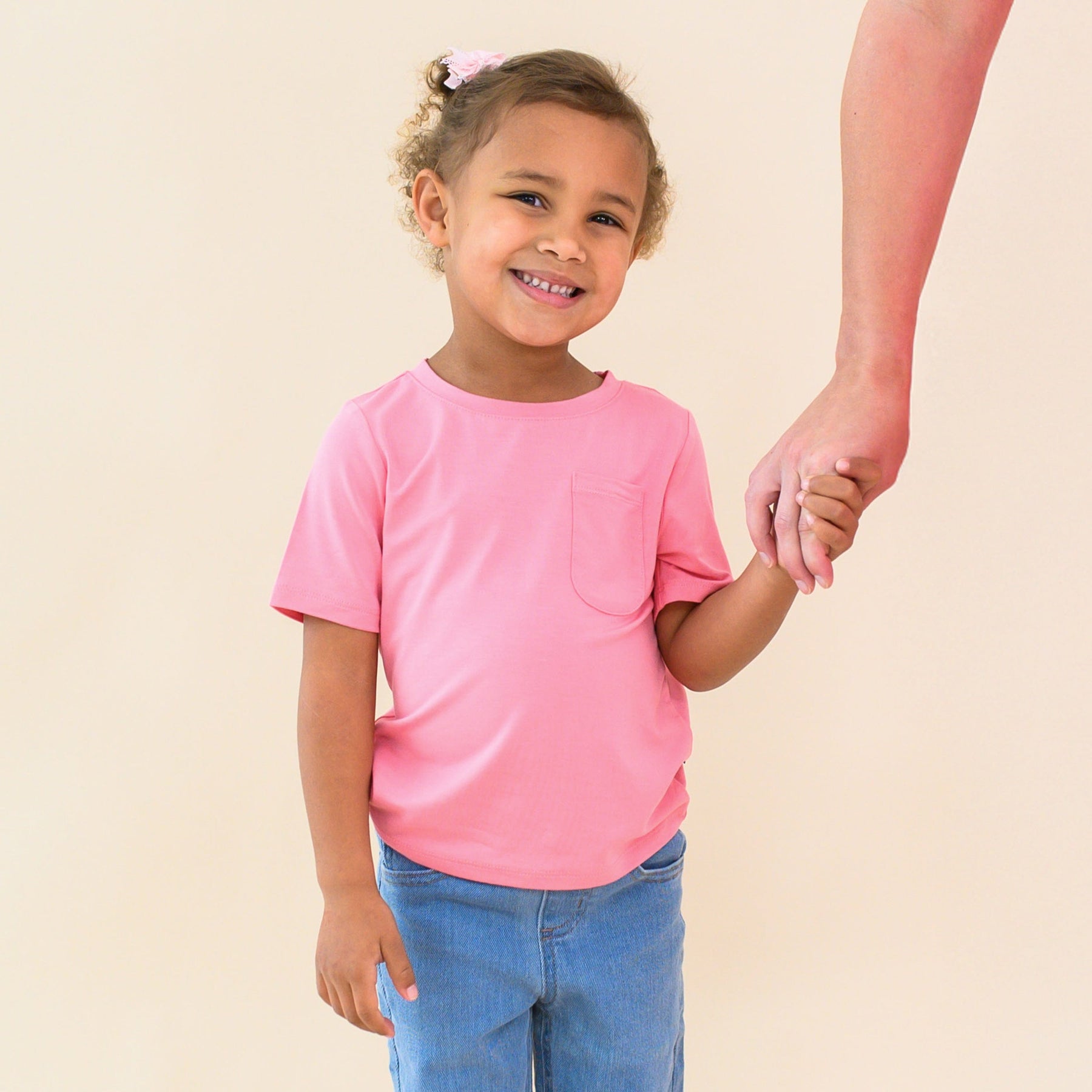 toddler modeling short sleeve crew neck in guava 