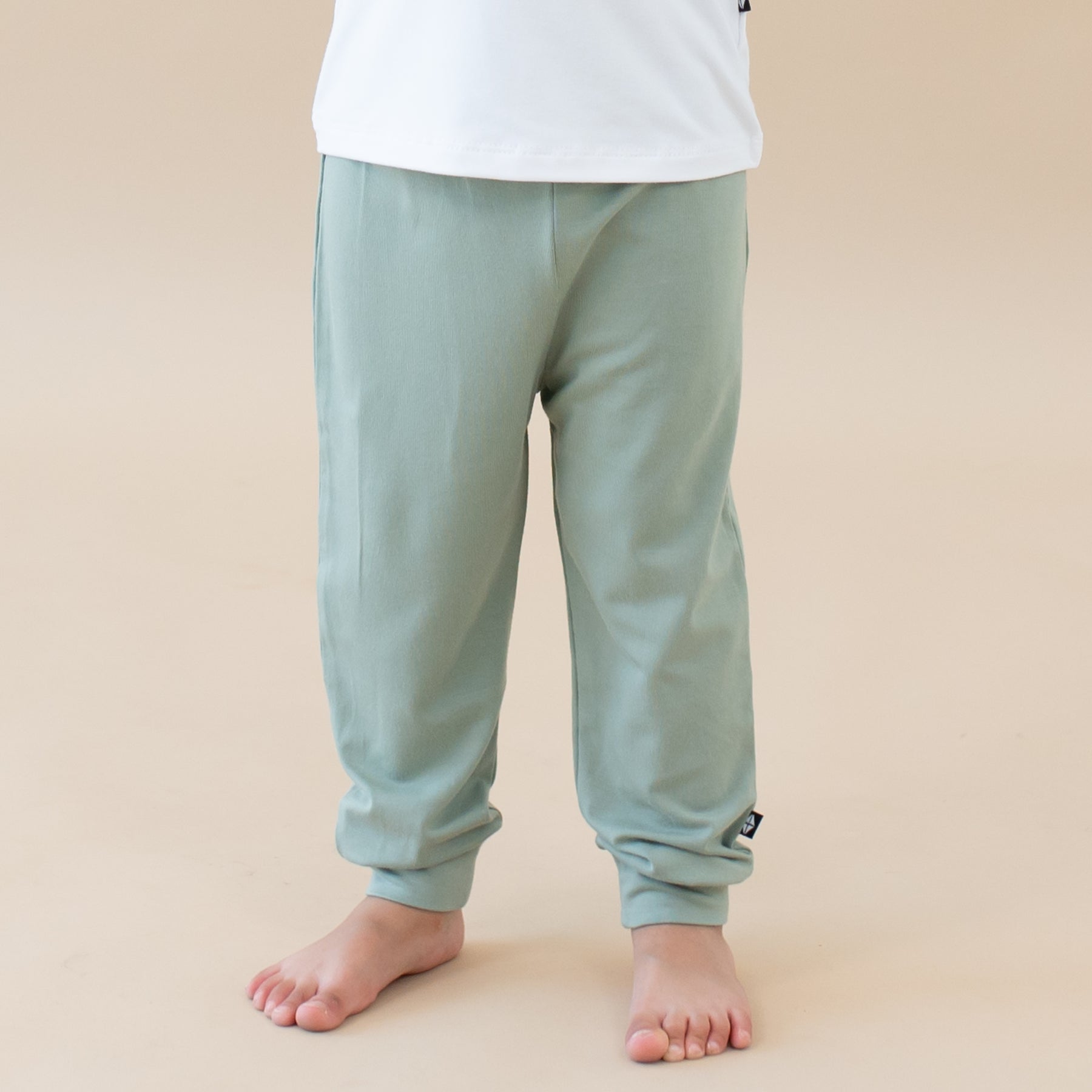 Toddler modeling Pant in Thyme close up 