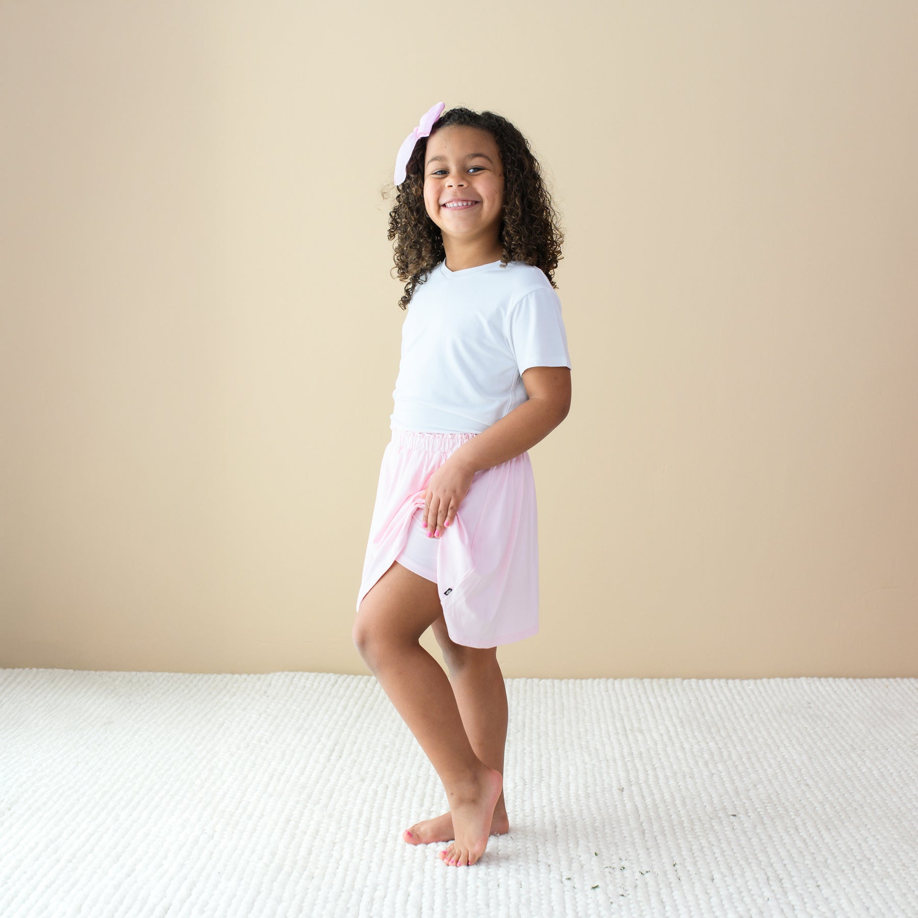 Toddler modeling Toddler Skort in Sakura showing there are built in shorts