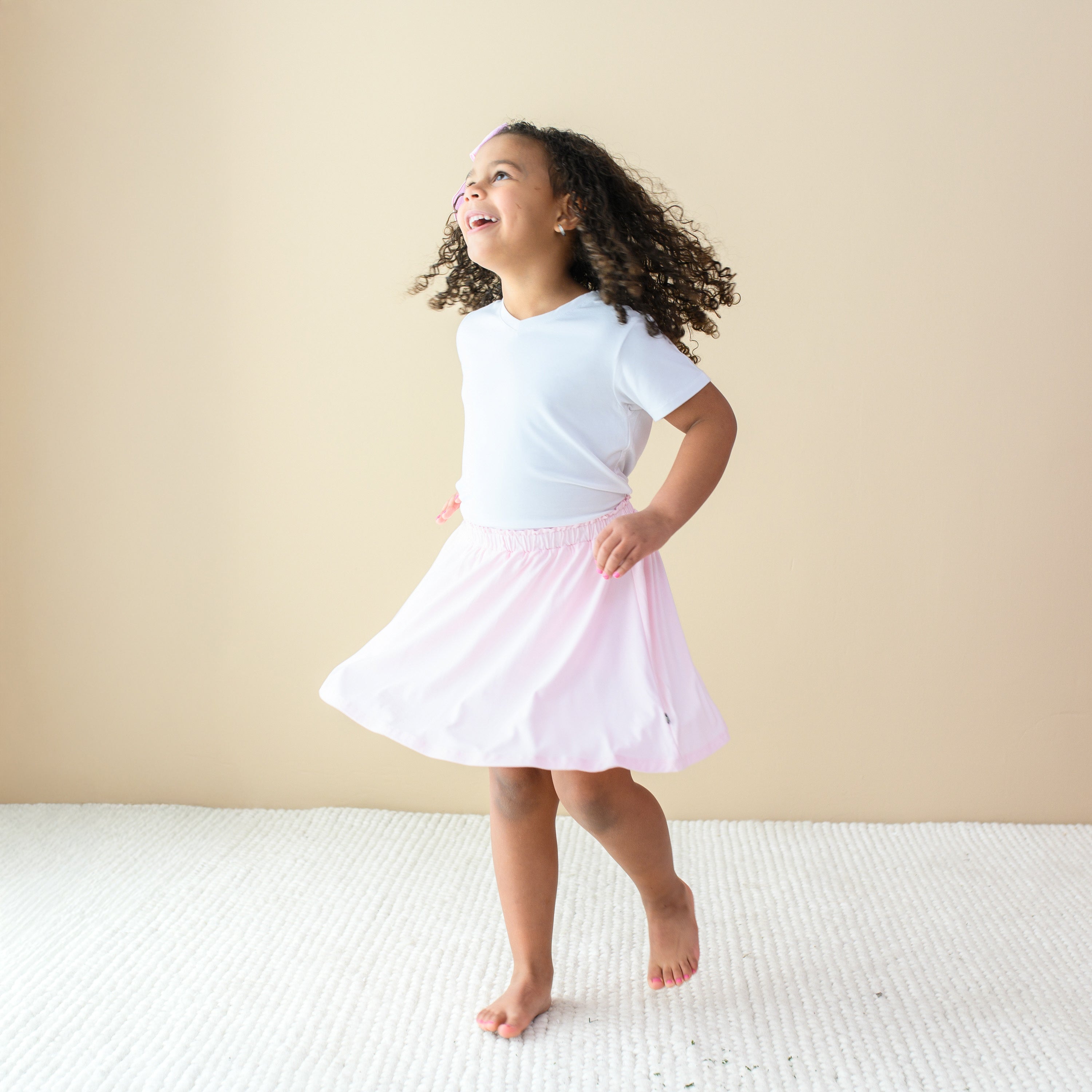 Toddler twirling in Toddler Skort in Sakura 