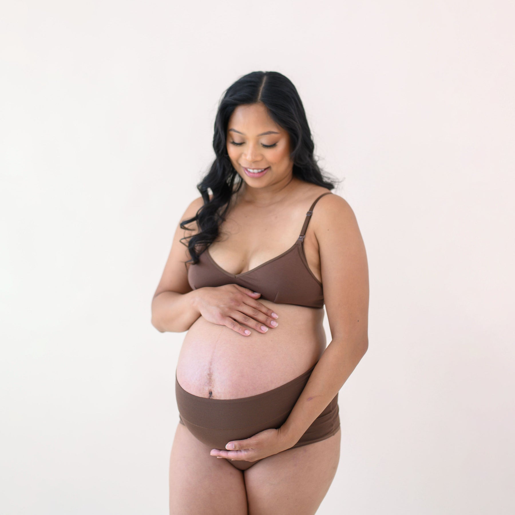 Pregnant woman modeling Women's High-Waisted Brief in Toffee and Nursing Bra