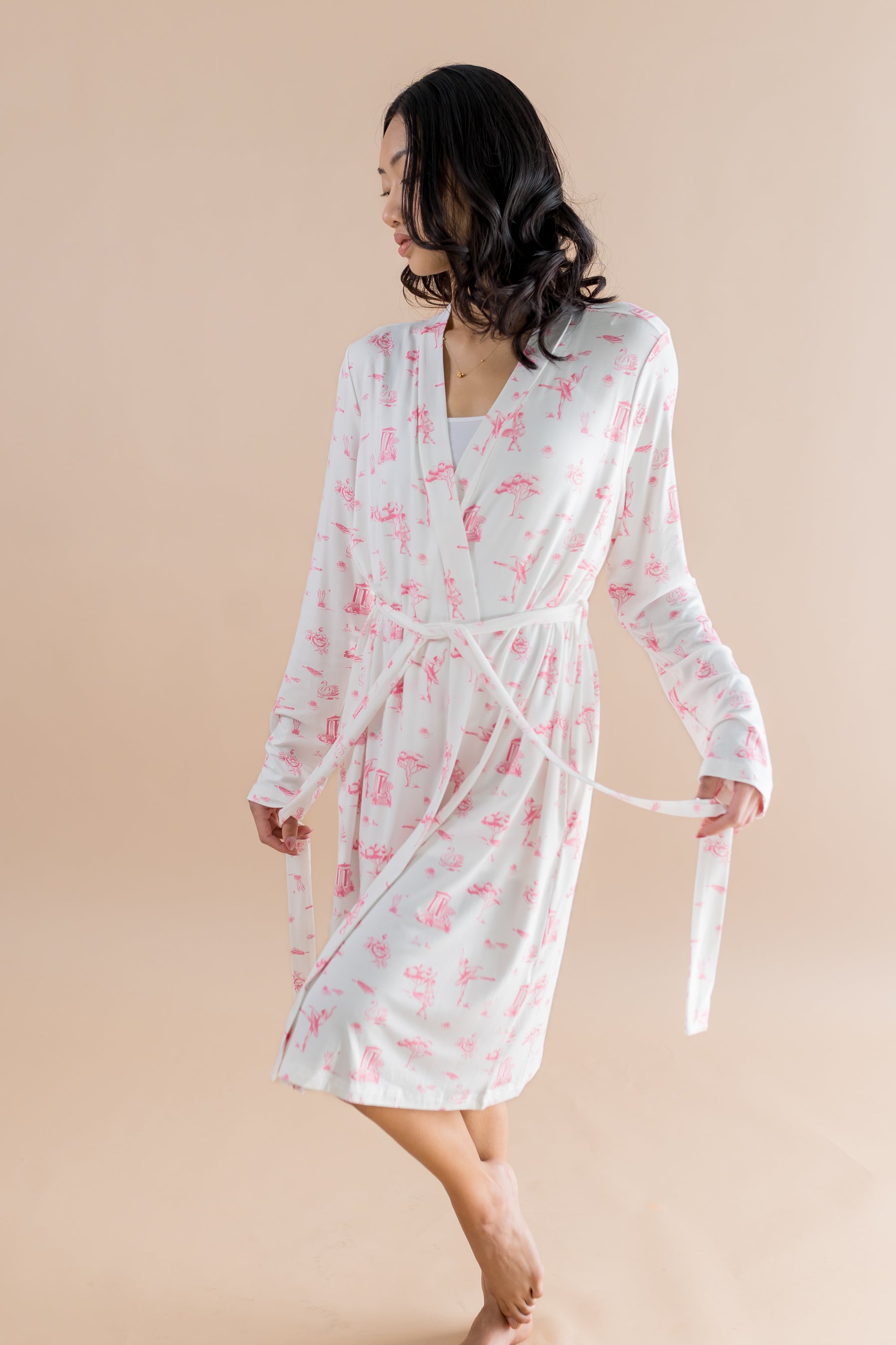 Female modeling the Women's Lounge Robe in Toile Ballet holding the end of the waist tie in each hand