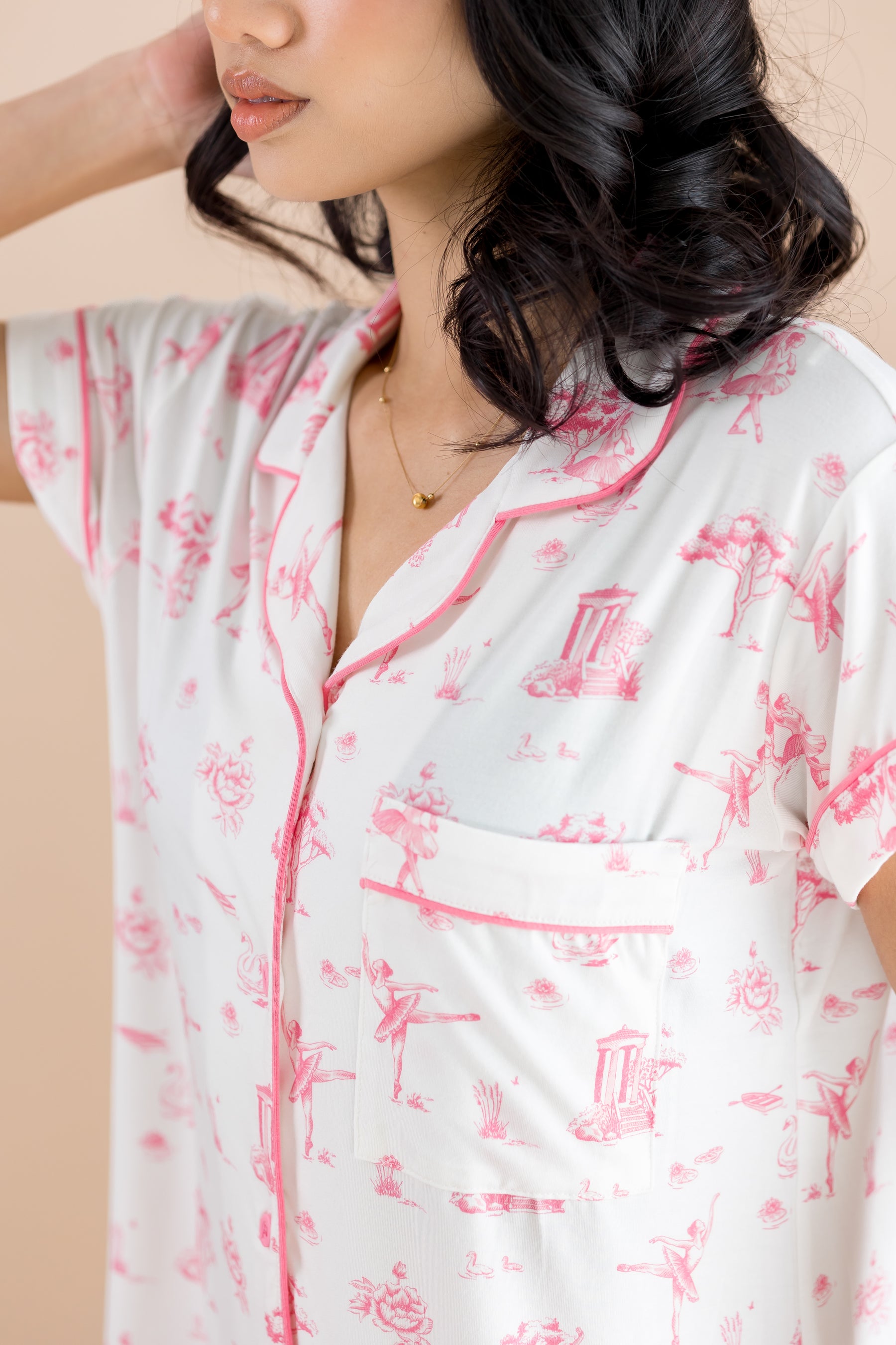 Close up of the collared neck, chest pocket and pink colored trim on the shirt of the Women's Short Sleeve Pajama Set in Toile Ballet