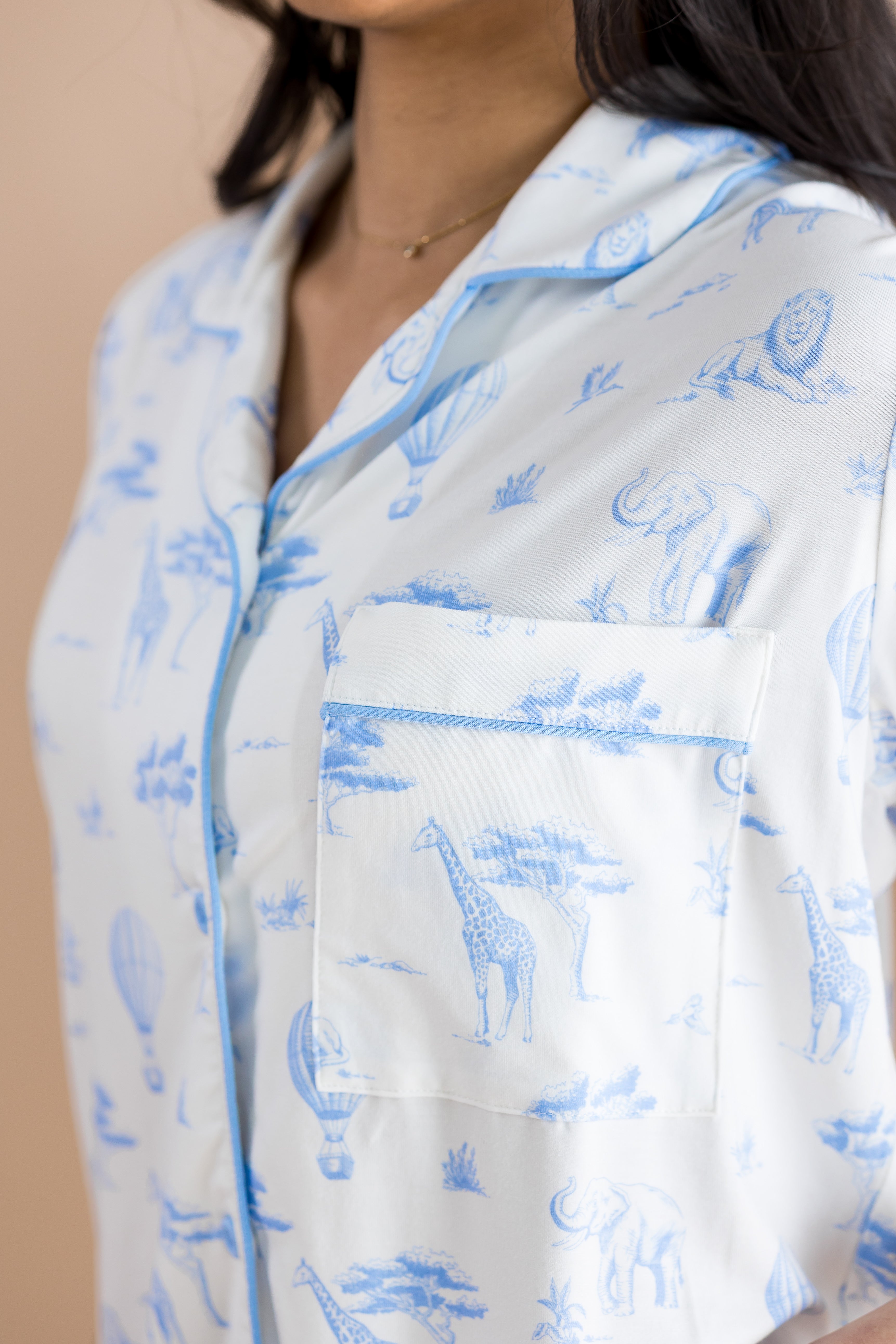 Close up of the chest pocket shown on the shirt of the Women's Short Sleeve Pajama Set in Toile Safari
