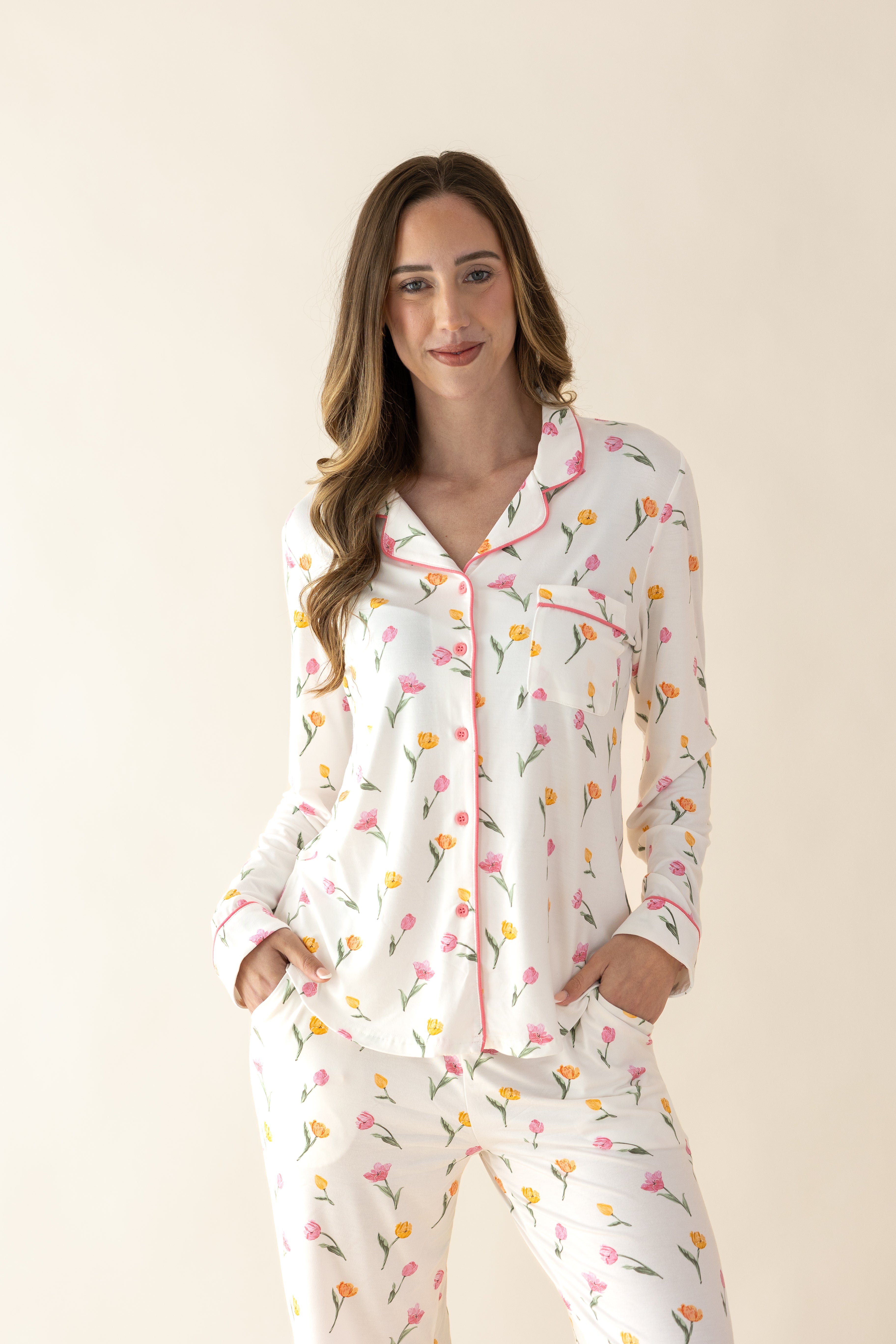 Female modeling the Long Sleeve Women’s Nightshirt in Tulip standing in front of a light taupe background