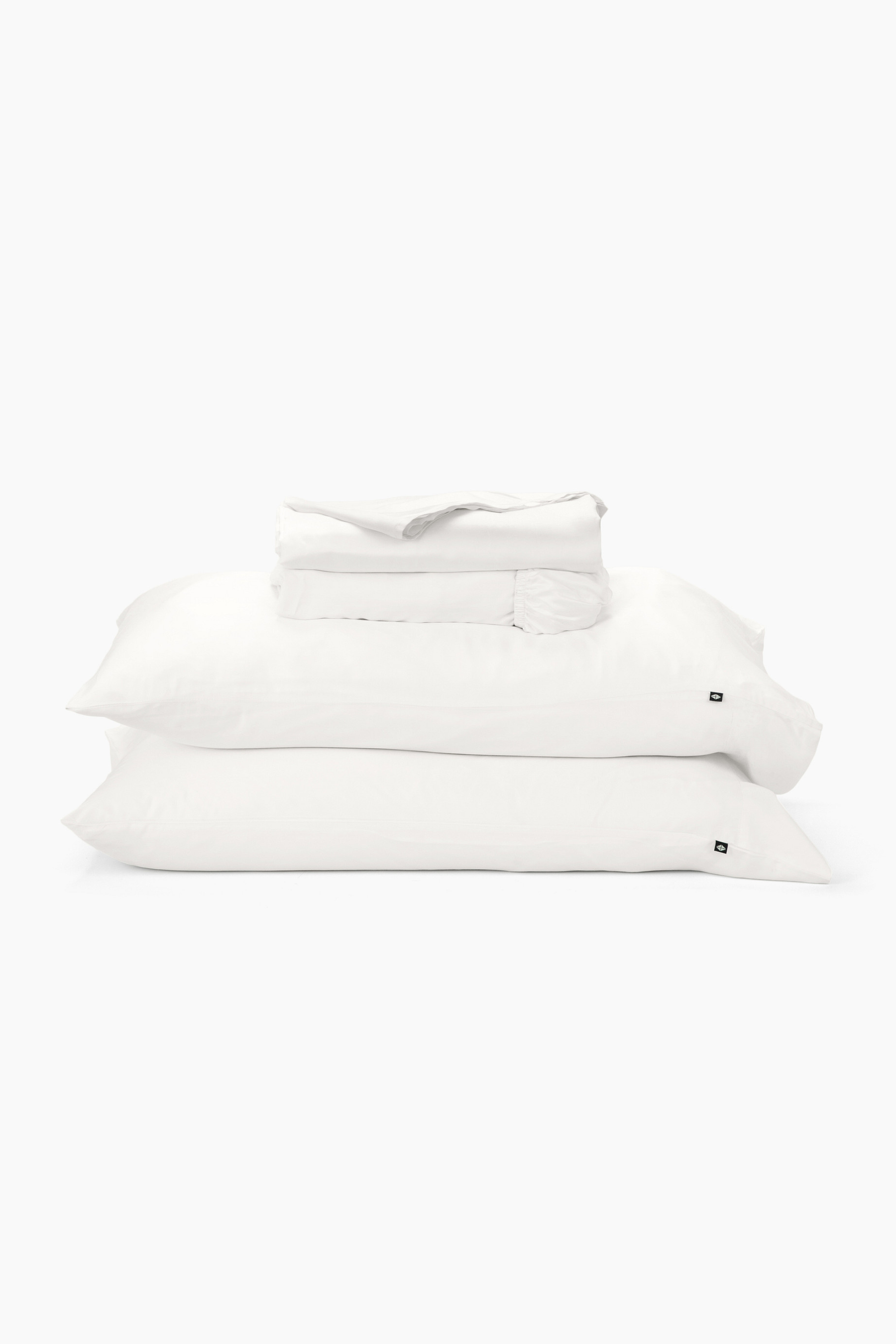 Stack of white pillows on a white background