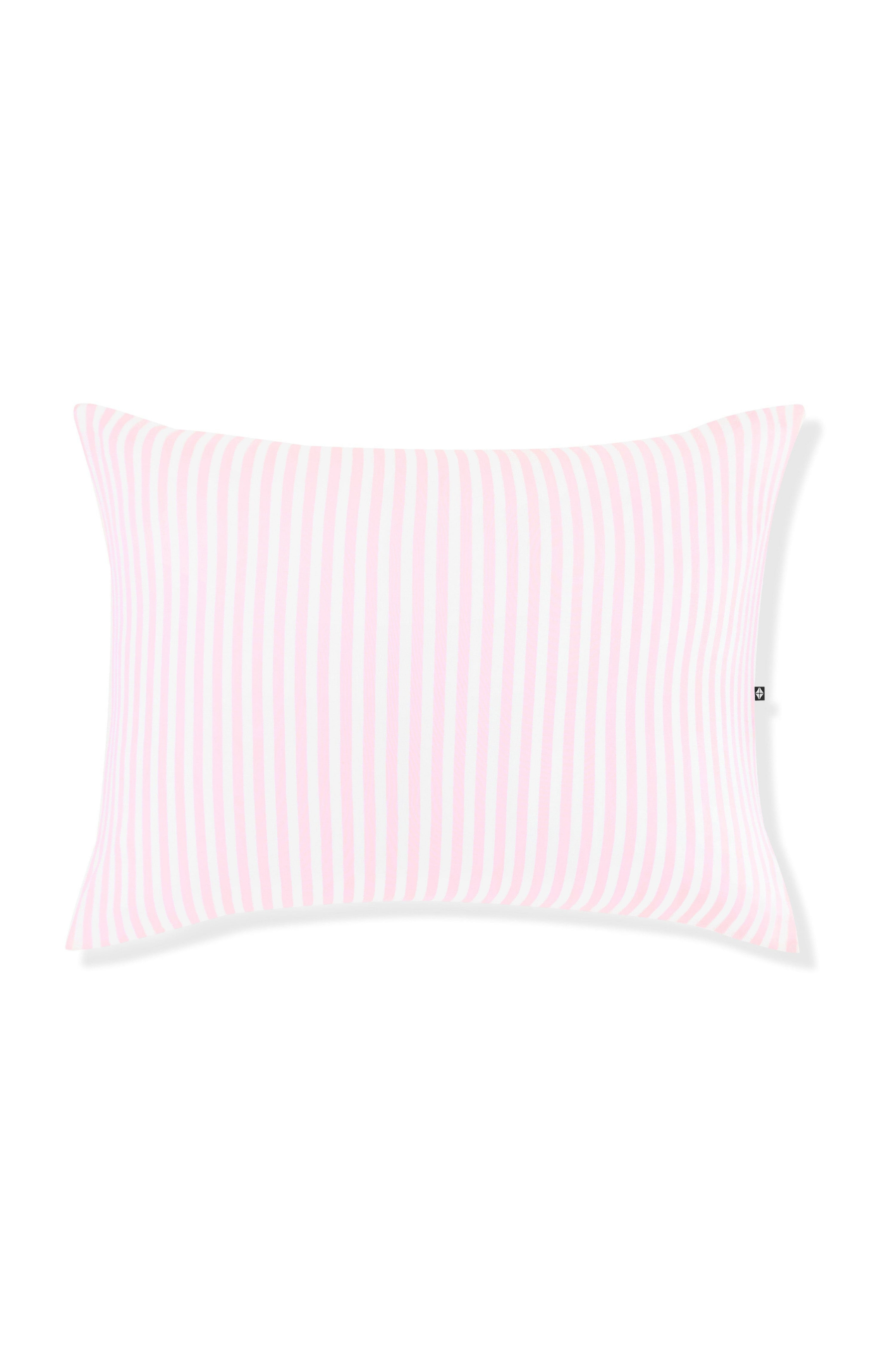 Pink and white striped pillow on a white background