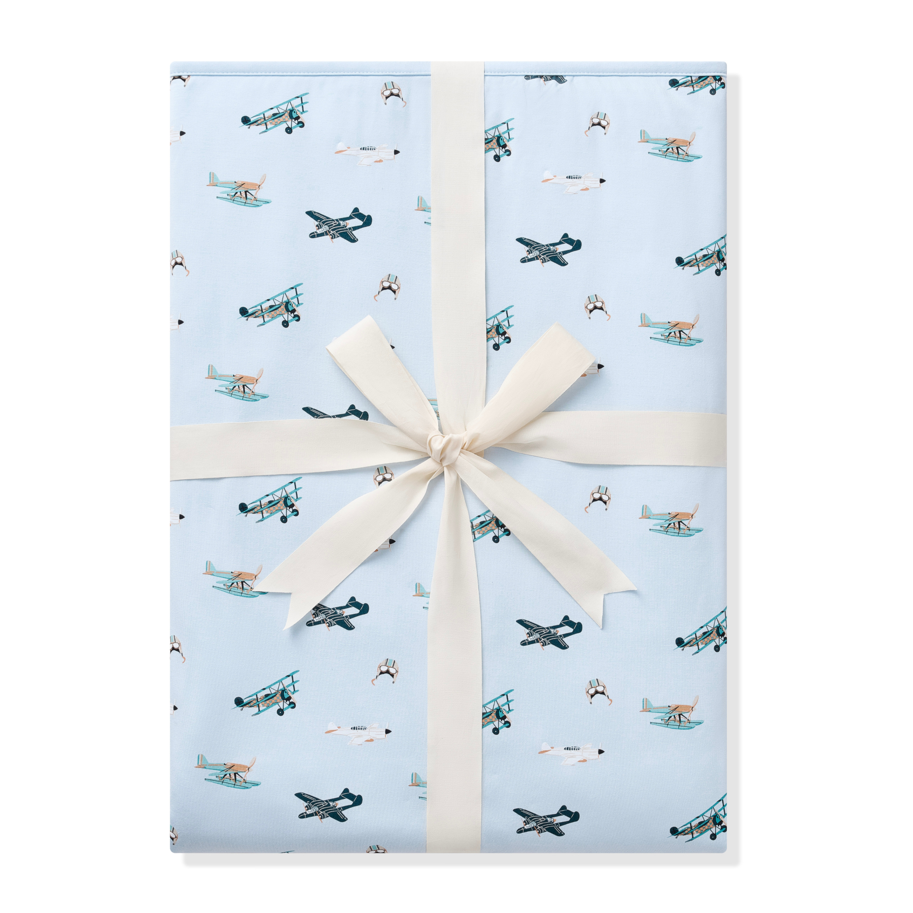 Youth Blanket in Take Off 1.0 shown wrapped in its packaging tied with a linen bow