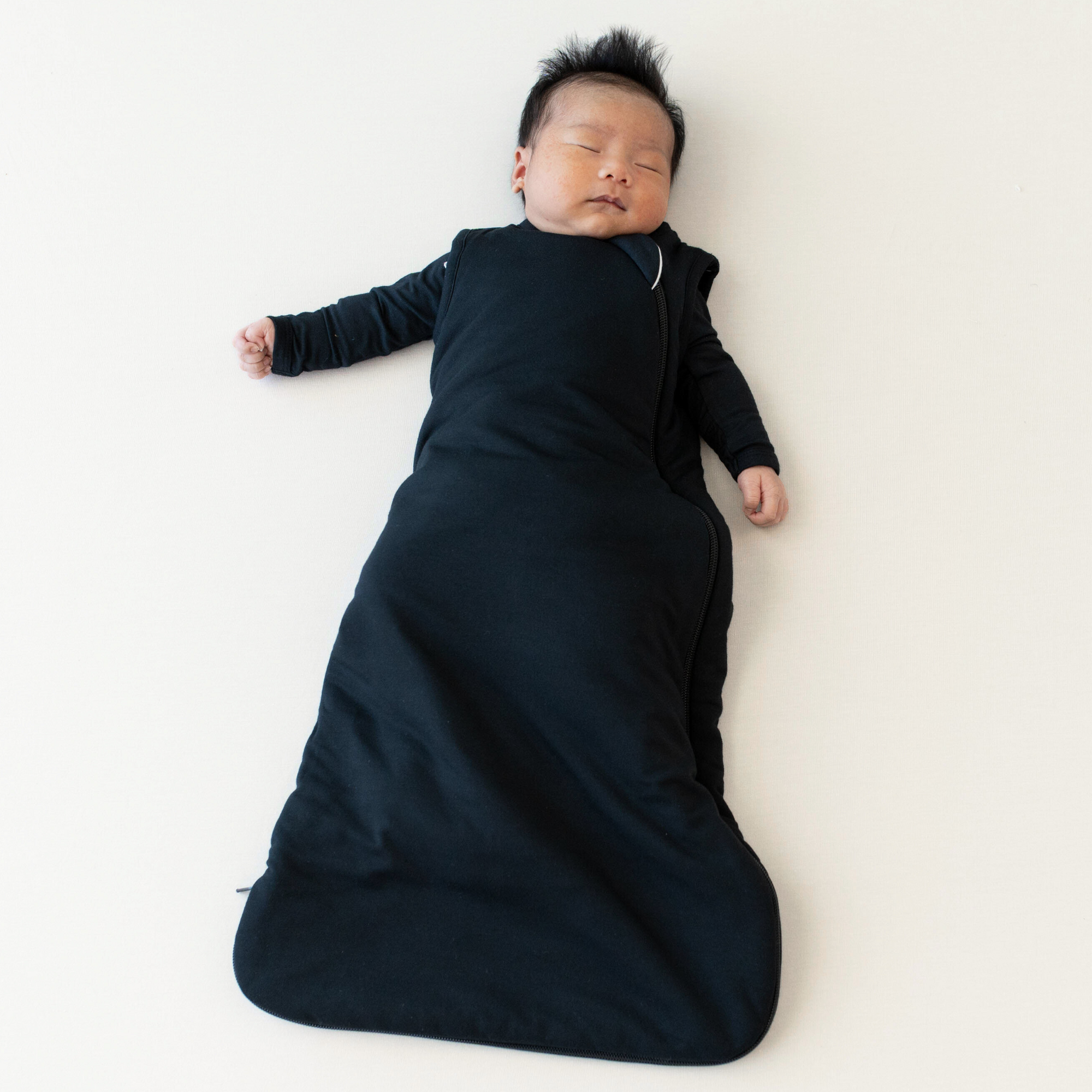 baby in 2.5 TOG sleep bag in midnight 