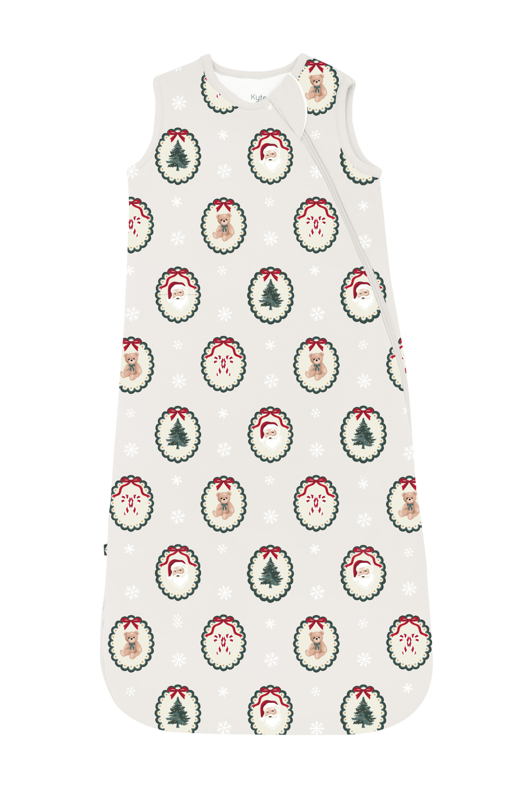 A sleeveless baby sleep sack with a Christmas holiday print, featuring Santa Claus and reindeer motifs inside green wreaths, snowflakes, and a subtle red-and-white striped border.